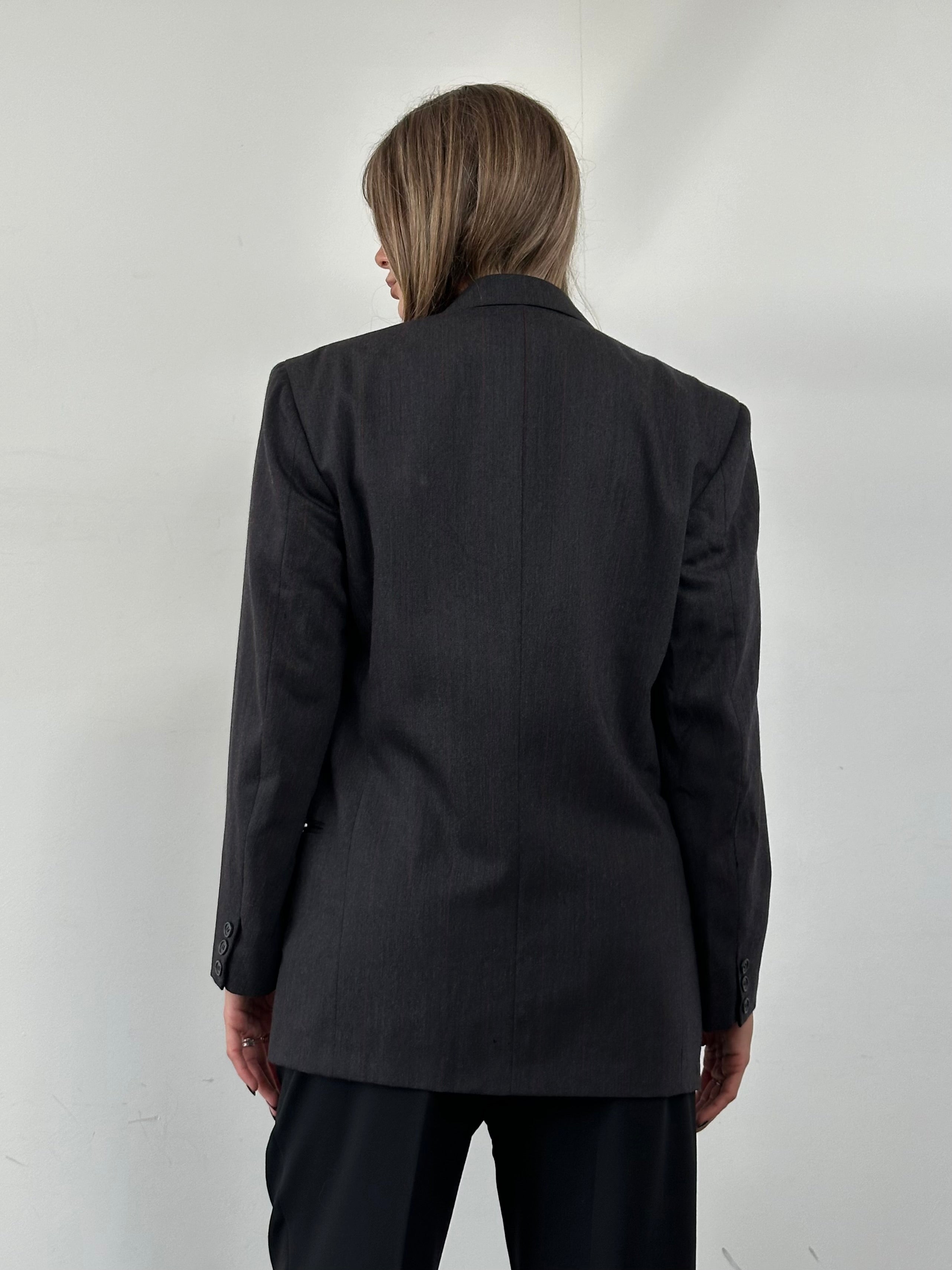 Valentino virgin wool double-breasted blazer in size 36R/S, tailored fit with classic lapels and button closure, stylish and sophisticated.