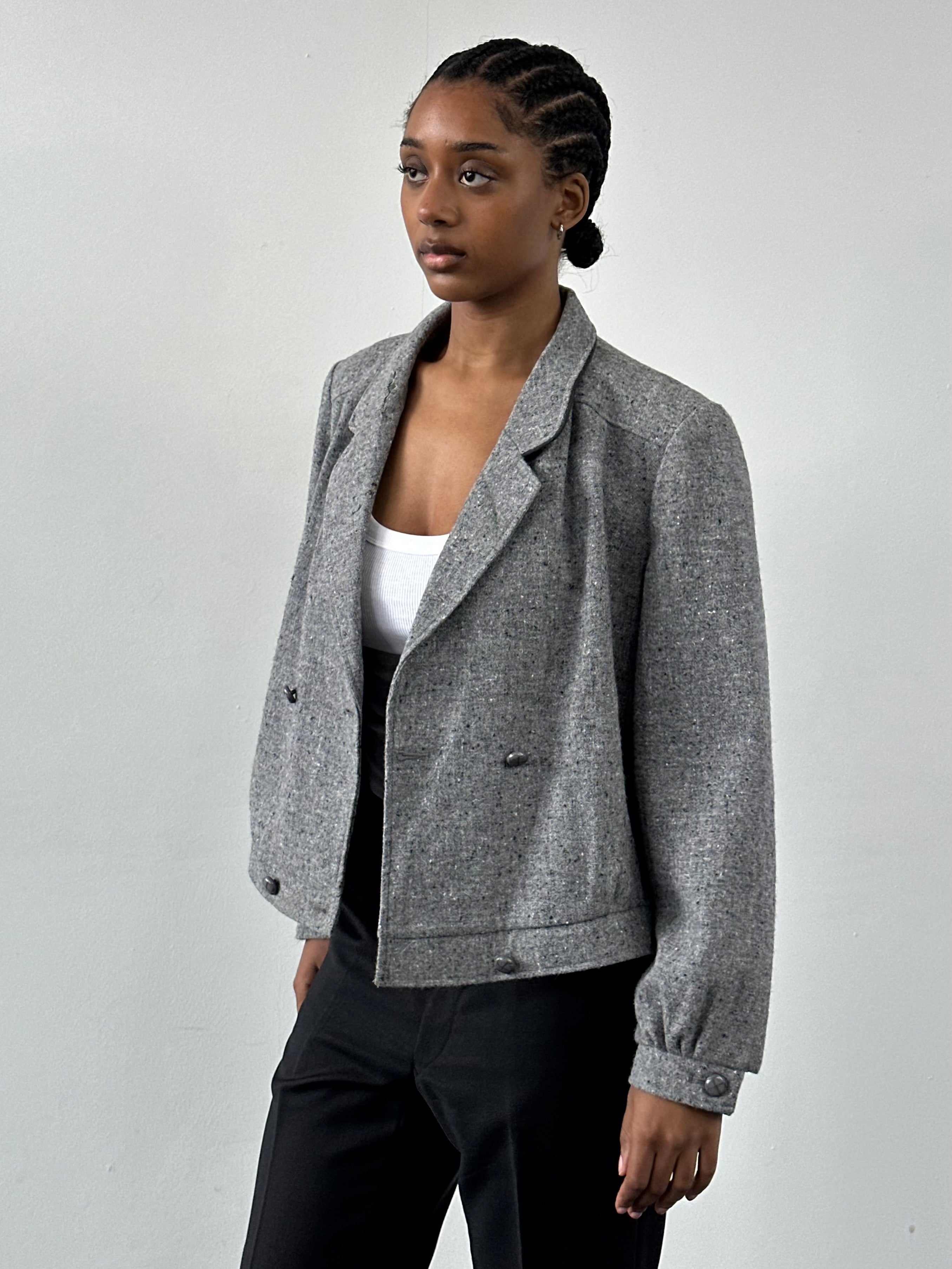 Vintage British 1980s pure wool bomber jacket in size M, featuring classic design and retro style.