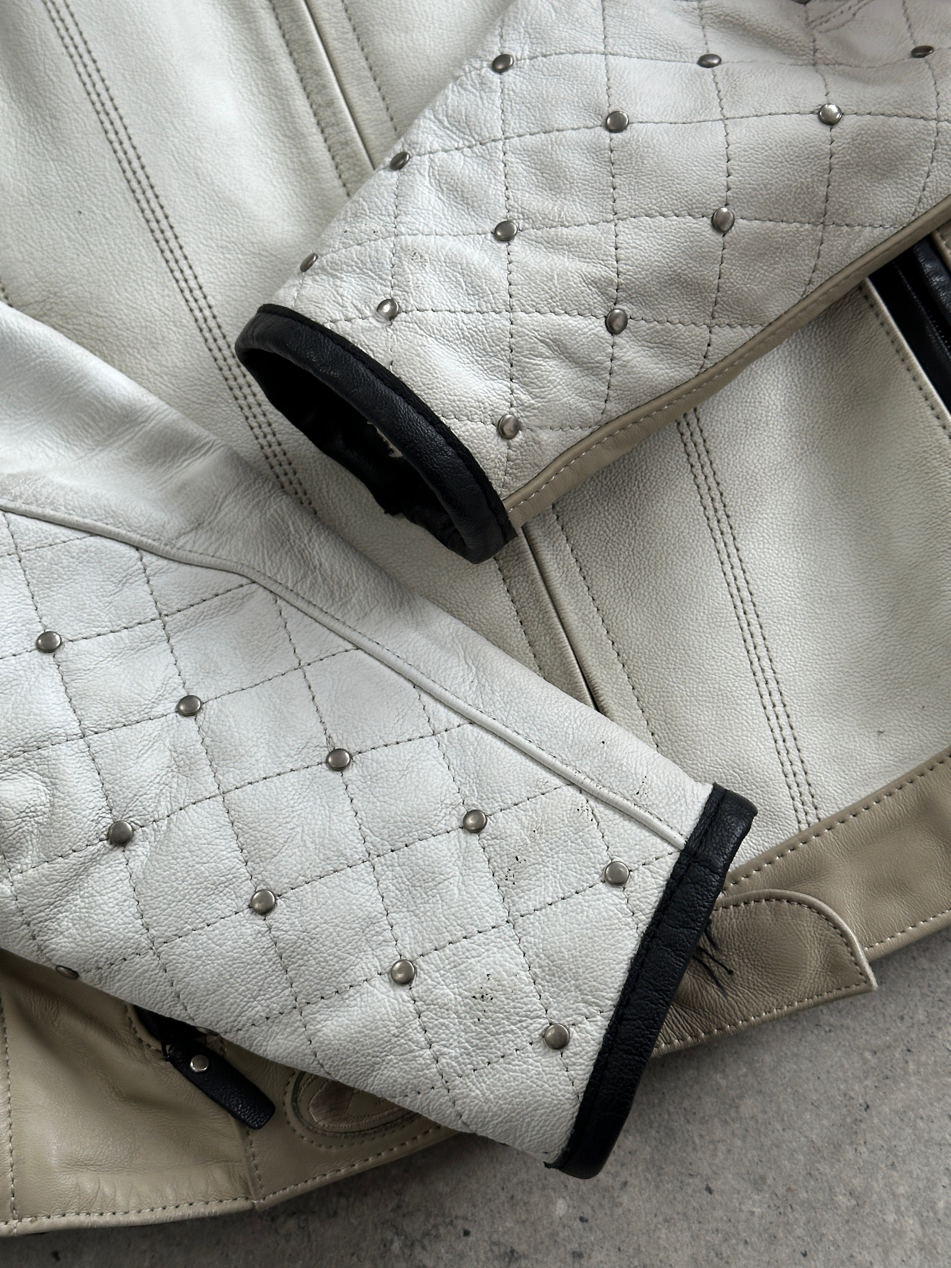 Vintage brand vintage motorcycle leather jacket in size S/M with classic biker style and detailed stitching.