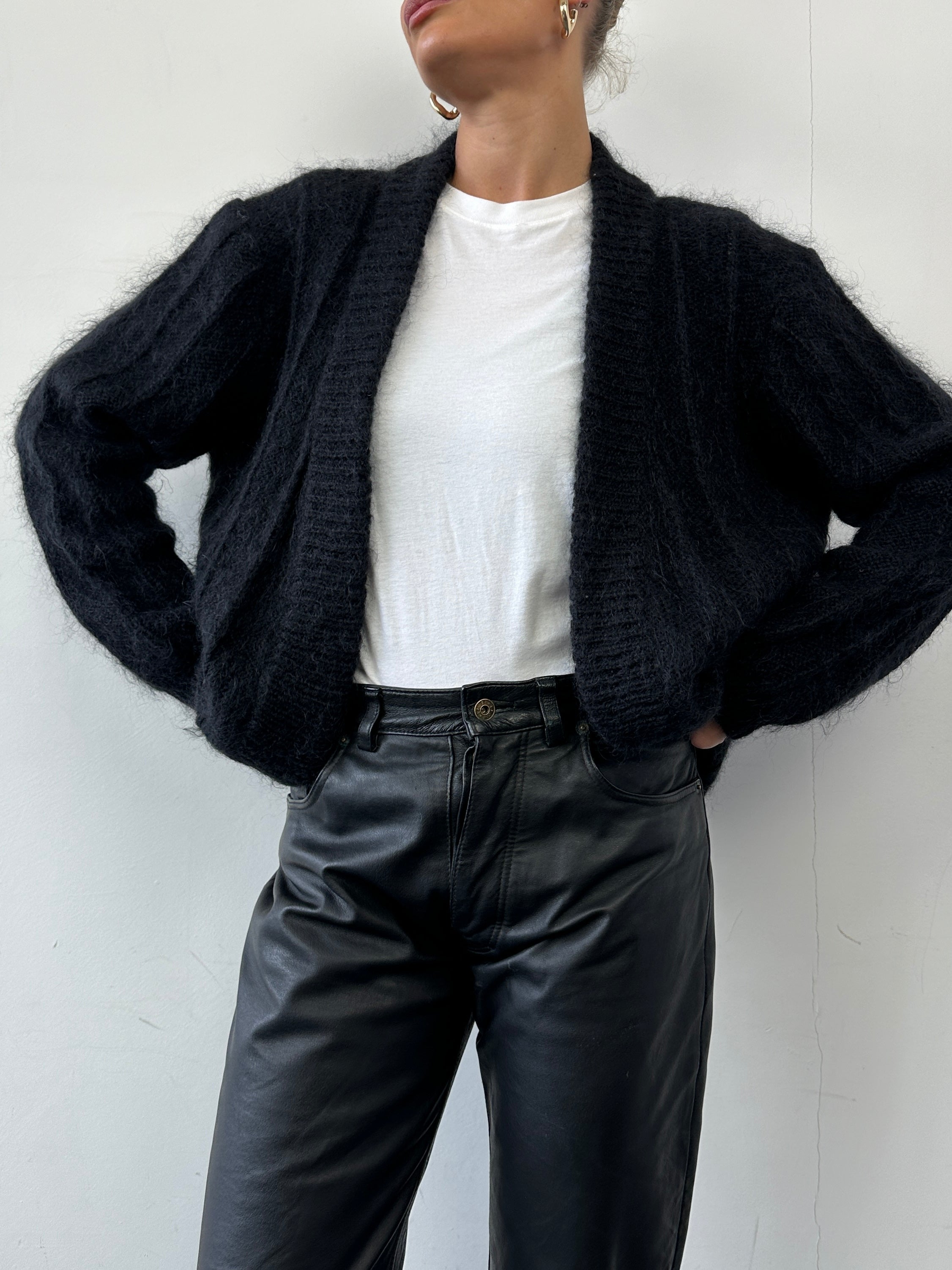 Vintage mohair knitted cardigan in size M, featuring a cozy, textured design and classic button closure.