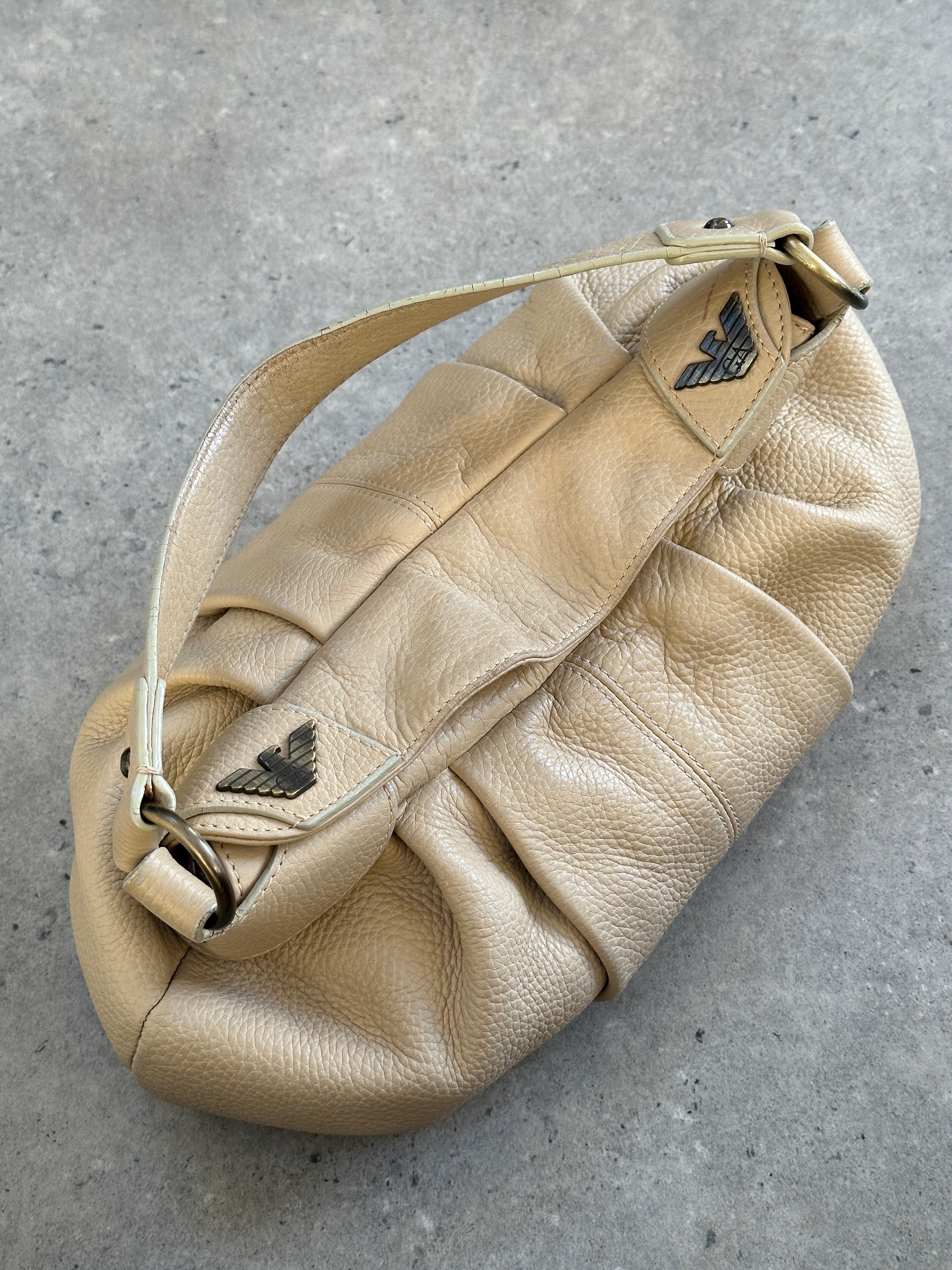 Emporio Armani leather pleated shoulder bag from the 2000s with a structured design and top handle, featuring a sleek, classic style.