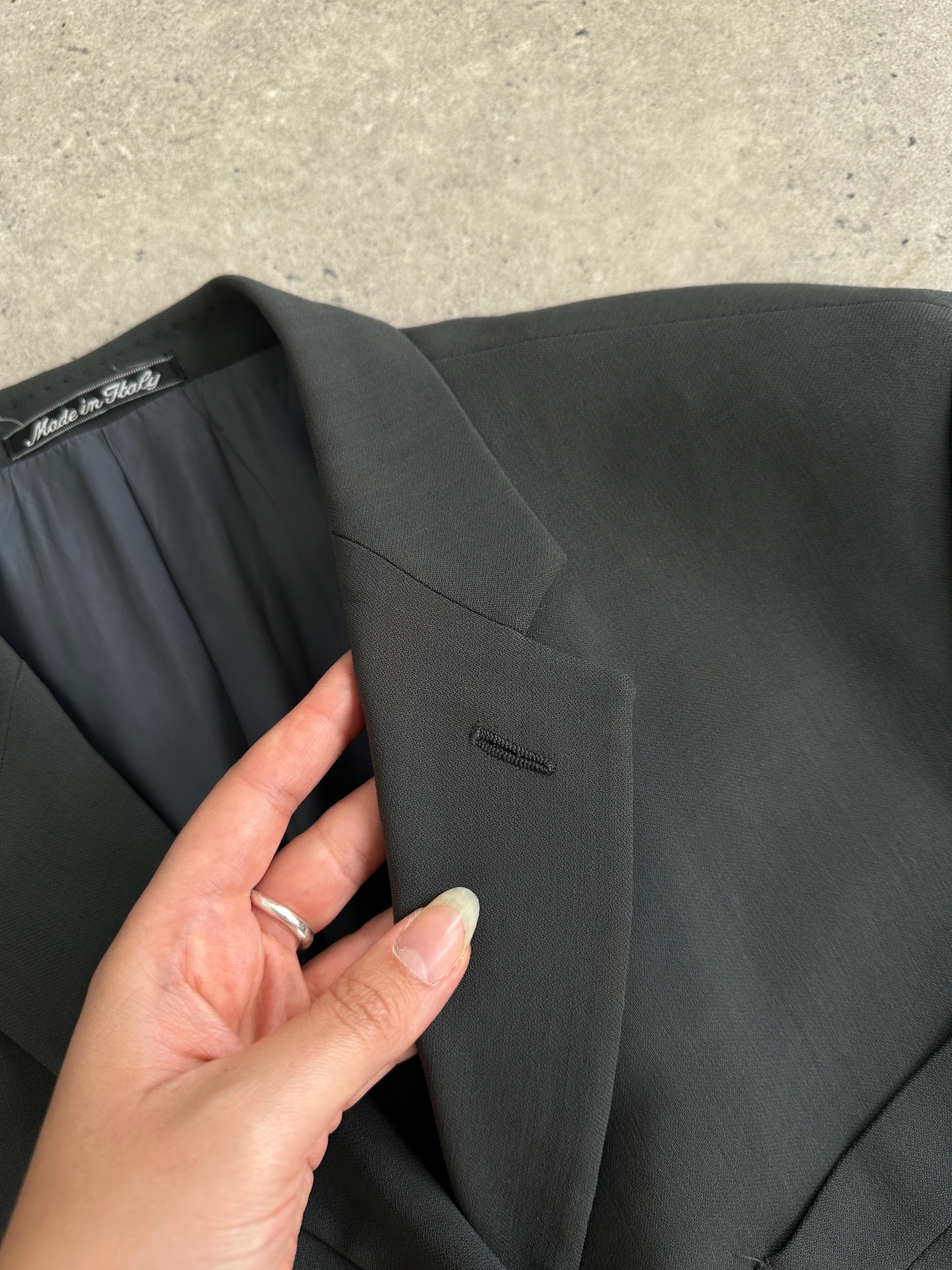 Giorgio Armani Le Collezioni wool relaxed single-breasted suit jumpsuit in size 42R/W34, shown on a hanger with a tailored fit.
