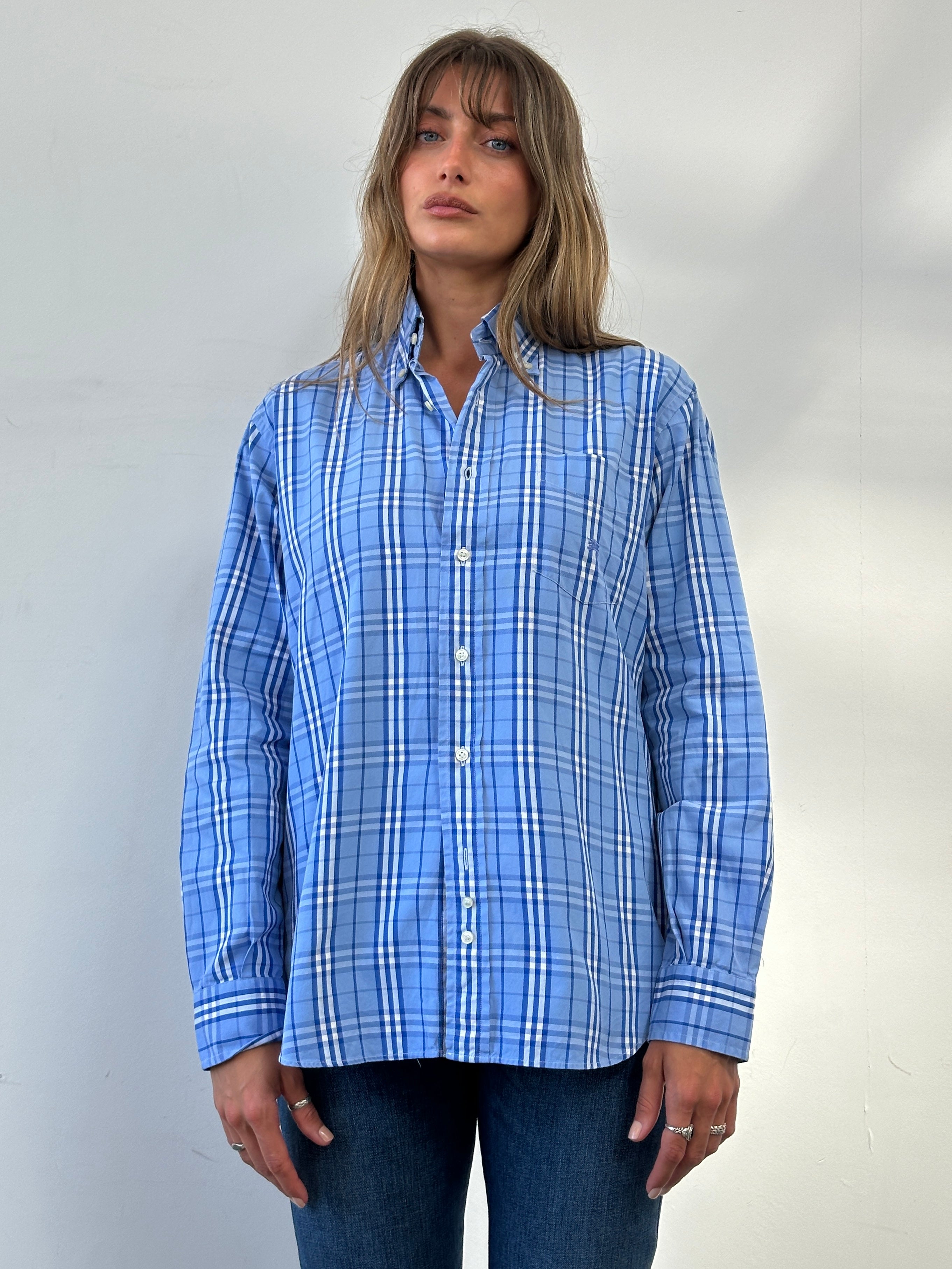 Burberry London Check cotton logo shirt displayed on a model, showcasing the classic pattern and casual fit in natural lighting.