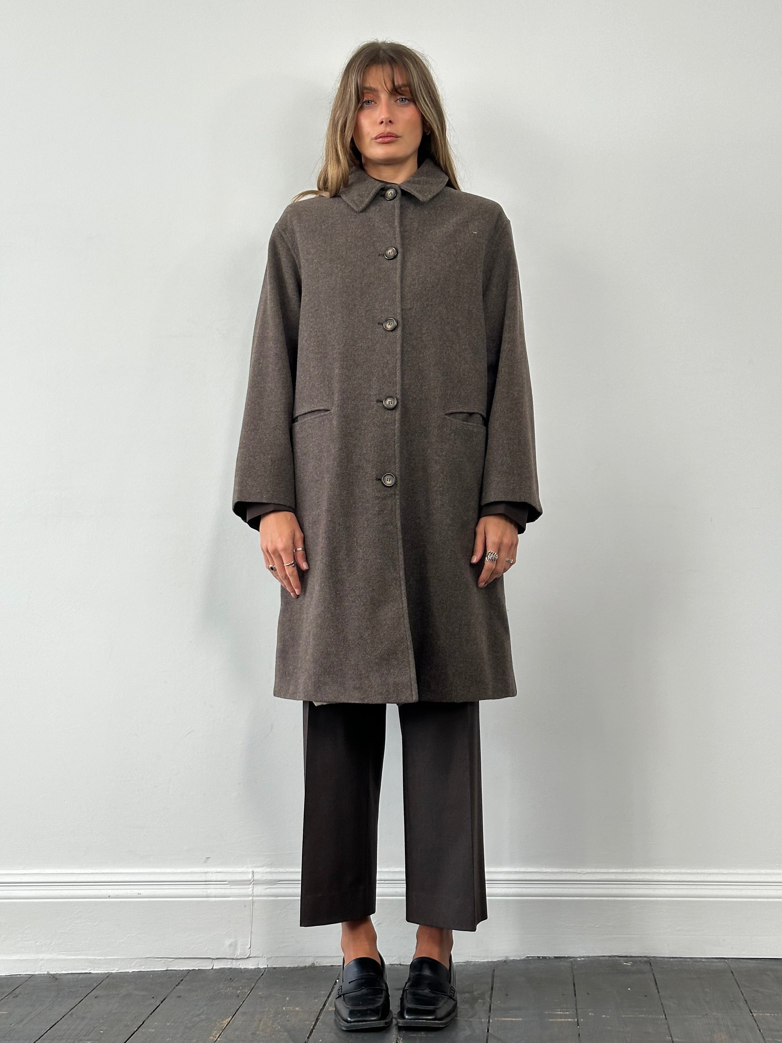 Armani Jeans pure virgin wool single-breasted coat in size L, tailored fit, classic collar, and button front, in a neutral color.