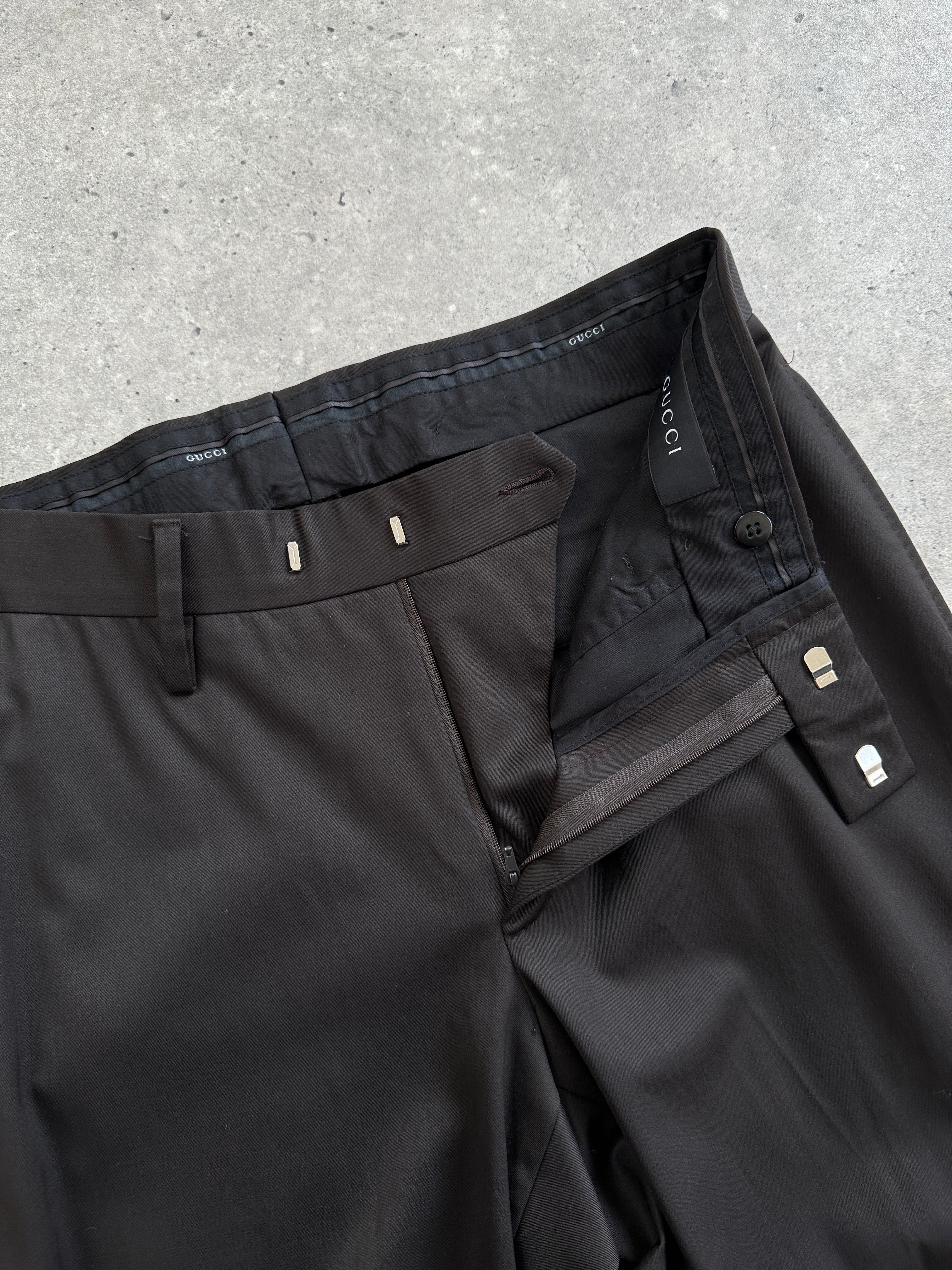 Gucci wool tailored trousers in size W30, featuring a sleek fit and classic design, displayed on a neutral background.