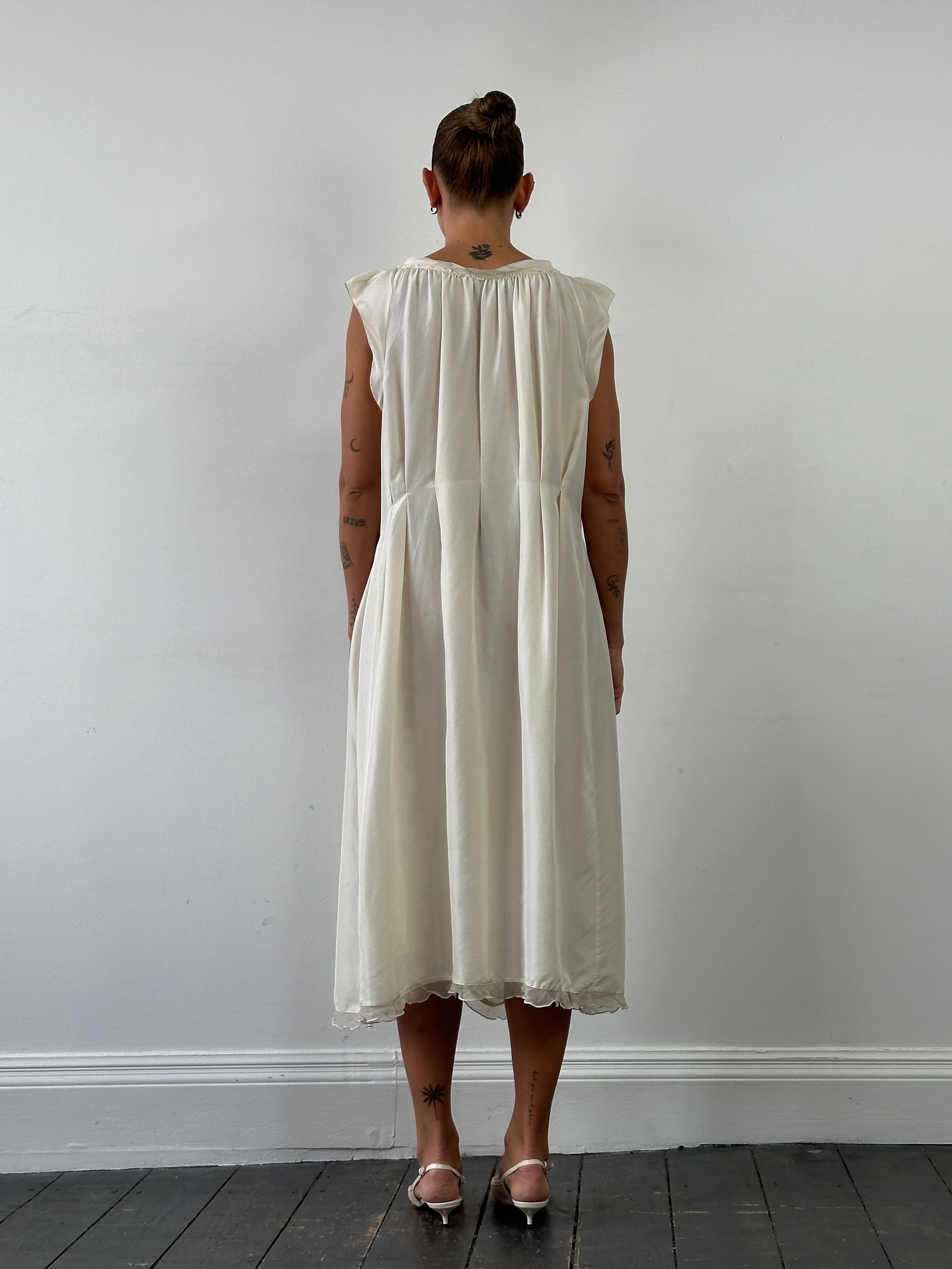 Prada 2012 pure silk pleated slip dress in size large, flowing design with elegant pleats and smooth silk fabric.