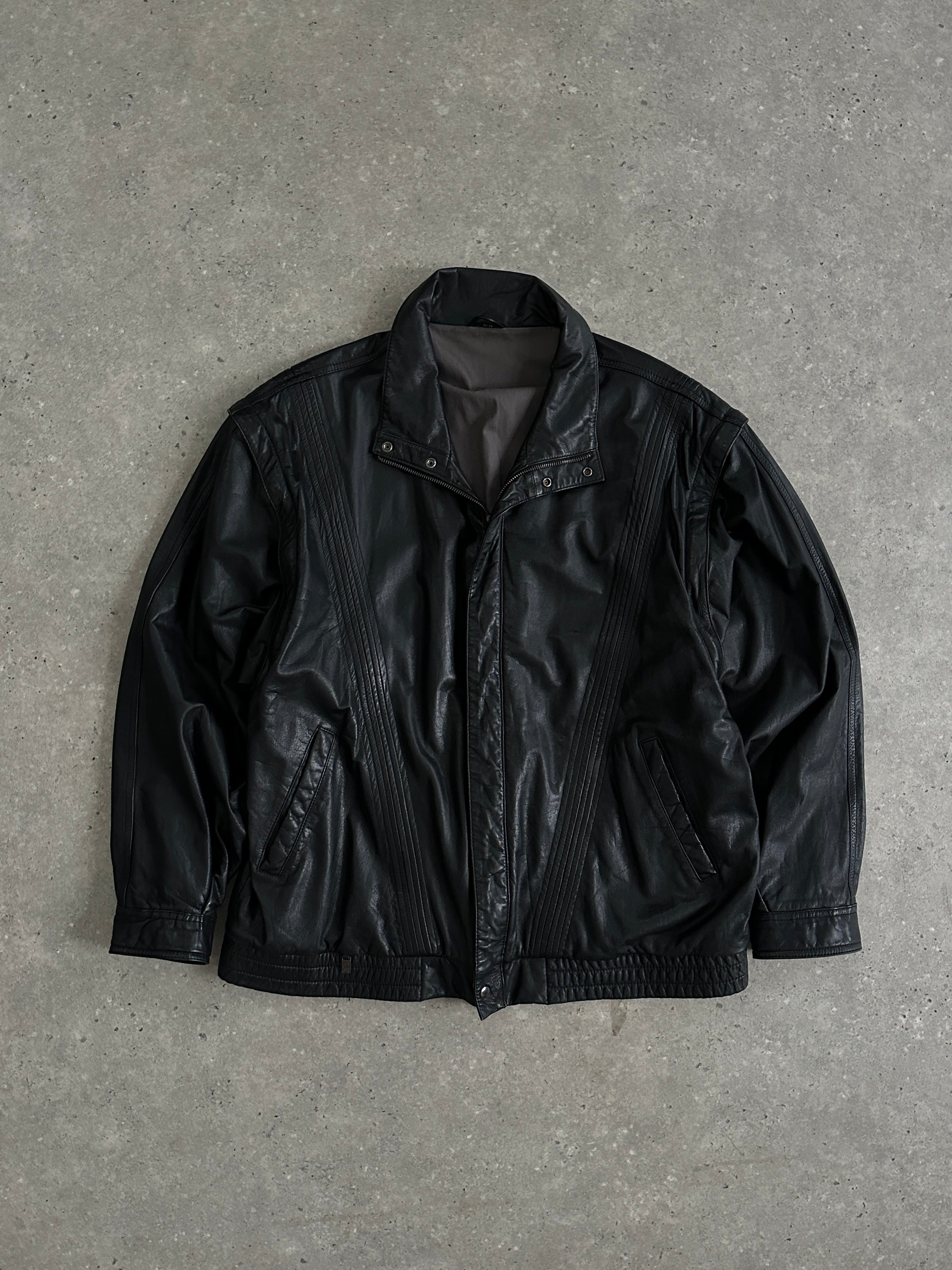 Vintage leather bomber gilet jacket in XL style, featuring classic design and rugged texture, suitable for casual wear.