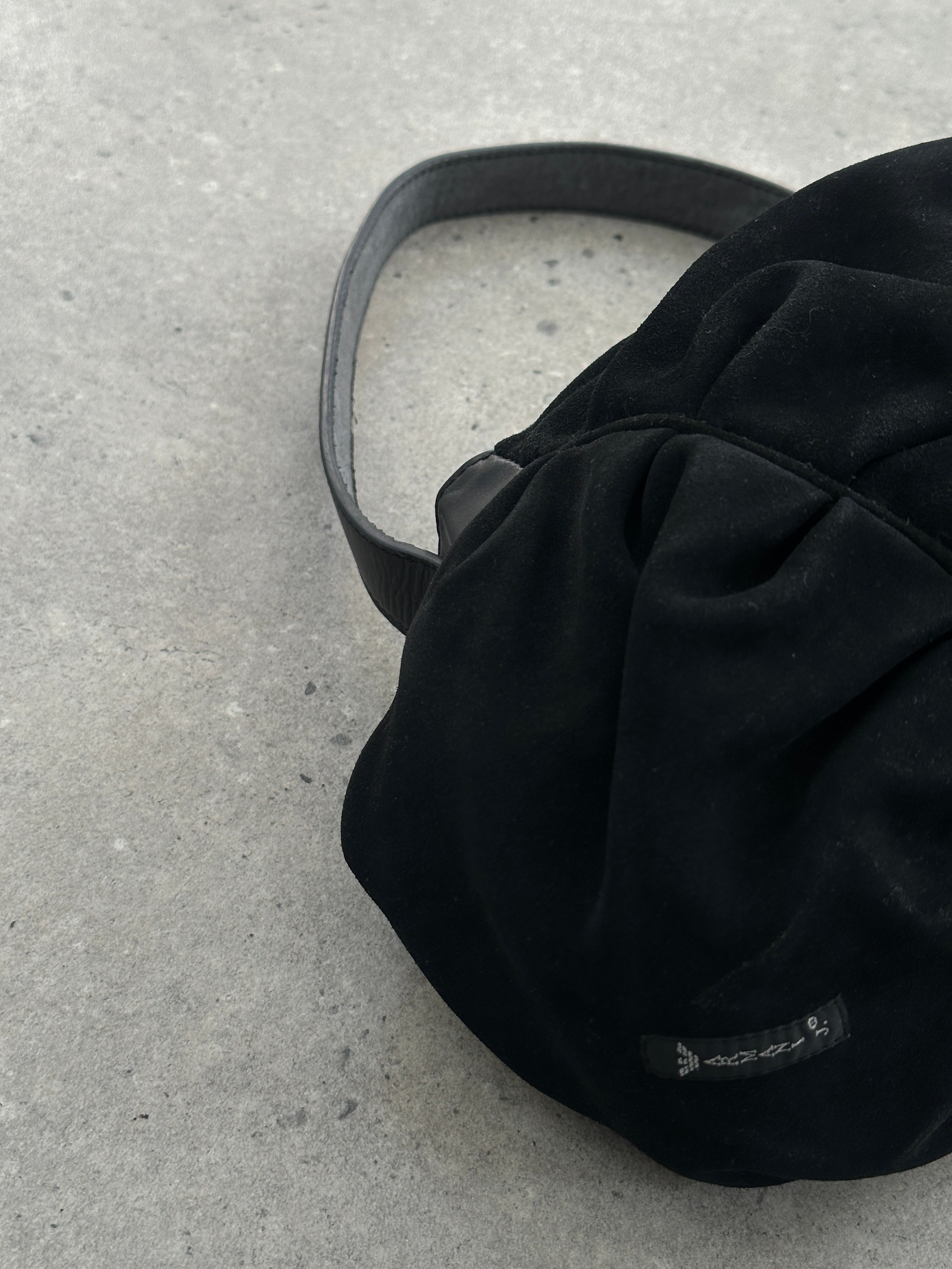 Armani Jeans suede ruched shoulder bag featuring a soft texture, stylish design, and a comfortable shoulder strap.