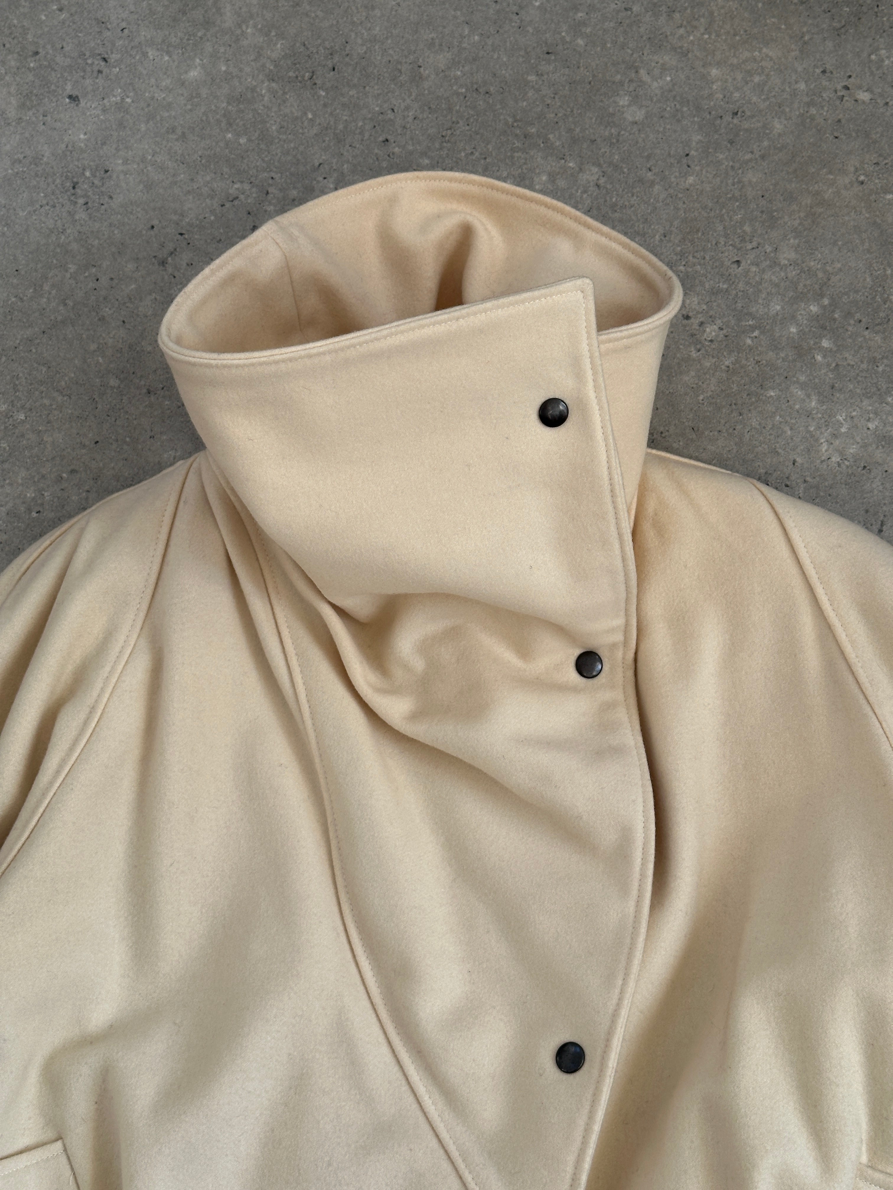 Vintage asymmetric wool bomber jacket with funnel neck in earthy tones, stylish and cozy for cold weather.