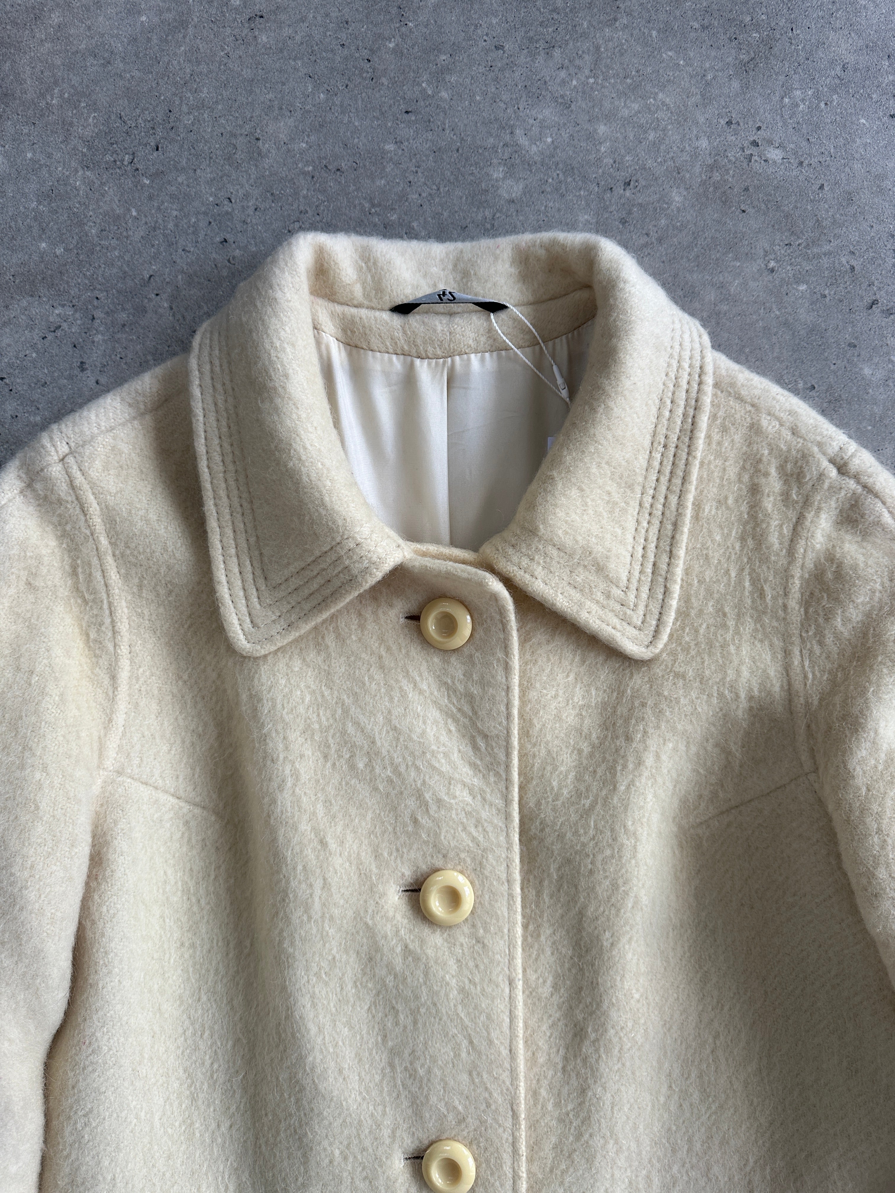 Vintage fuzzy wool mohair single-breasted coat in size L, showcasing its cozy textured fabric and classic design.