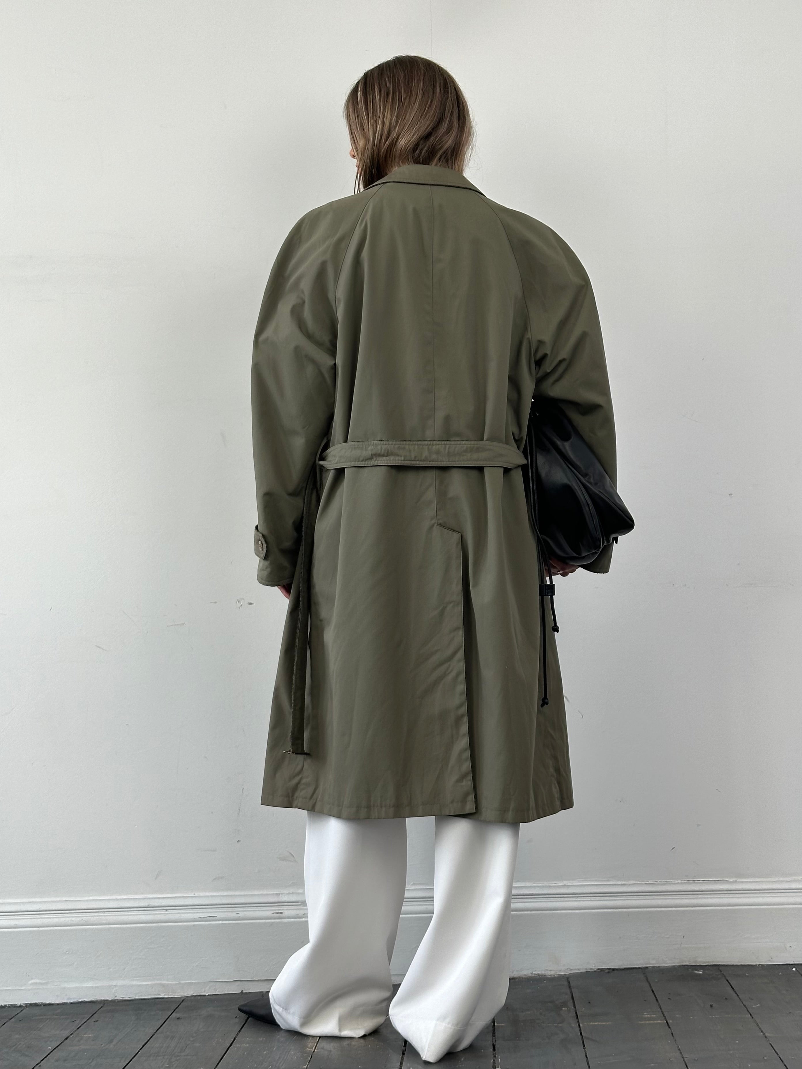 Vintage reversible wool trench coat with belt, oversized XL fit, classic style, shown hanging on a wooden hanger.
