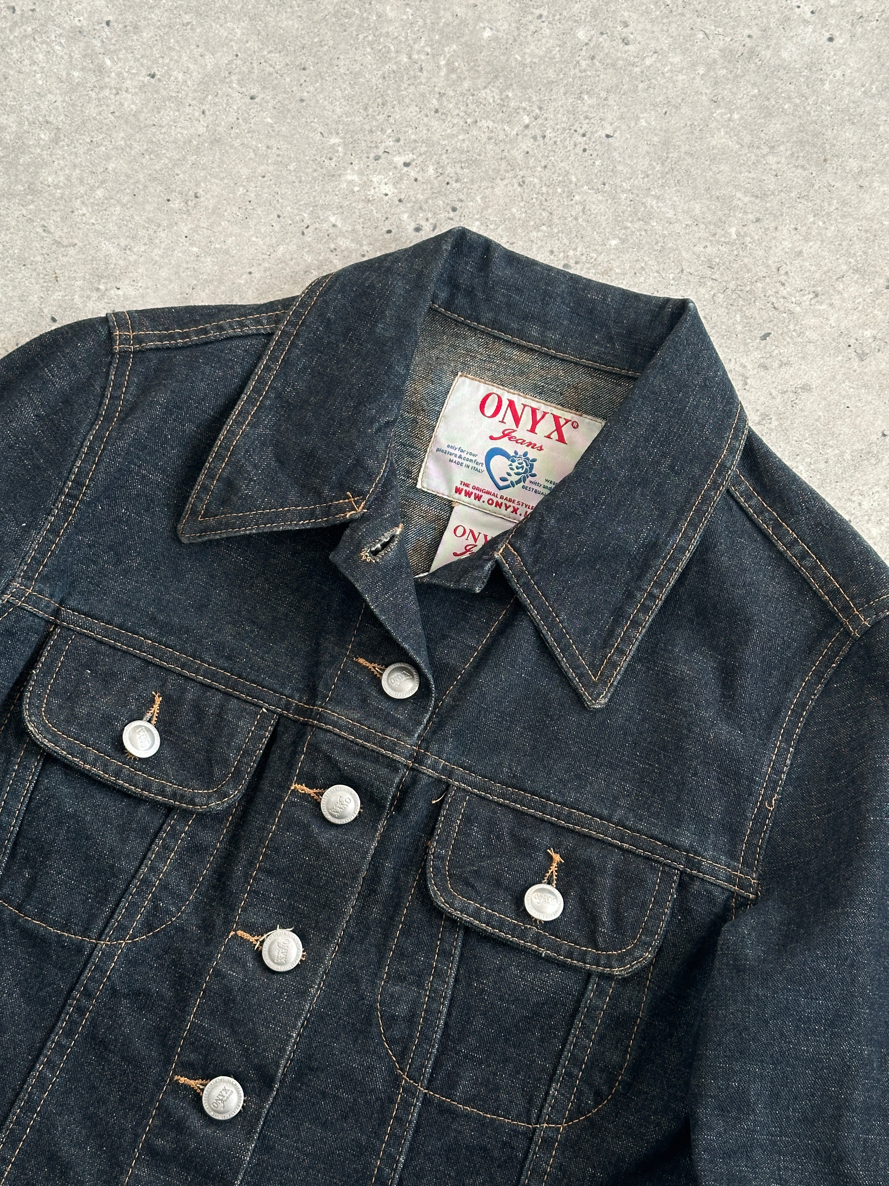Vintage Italian raw denim fitted jacket in XS/S size, showcasing classic distressed denim style and tailored fit.