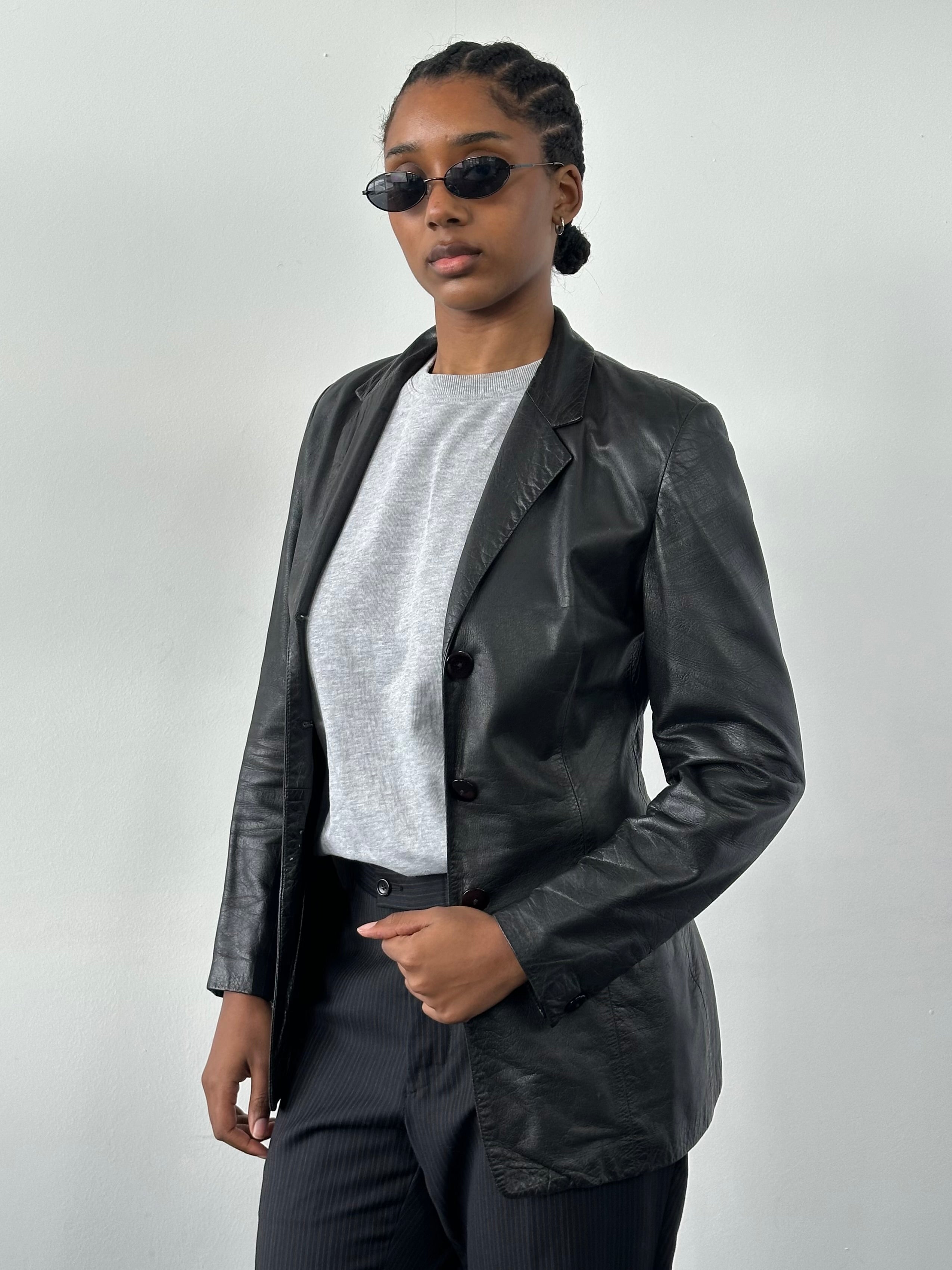 Versace 1990s fitted leather jacket in XS with classic design and detailed stitching, showcasing high-quality genuine leather.