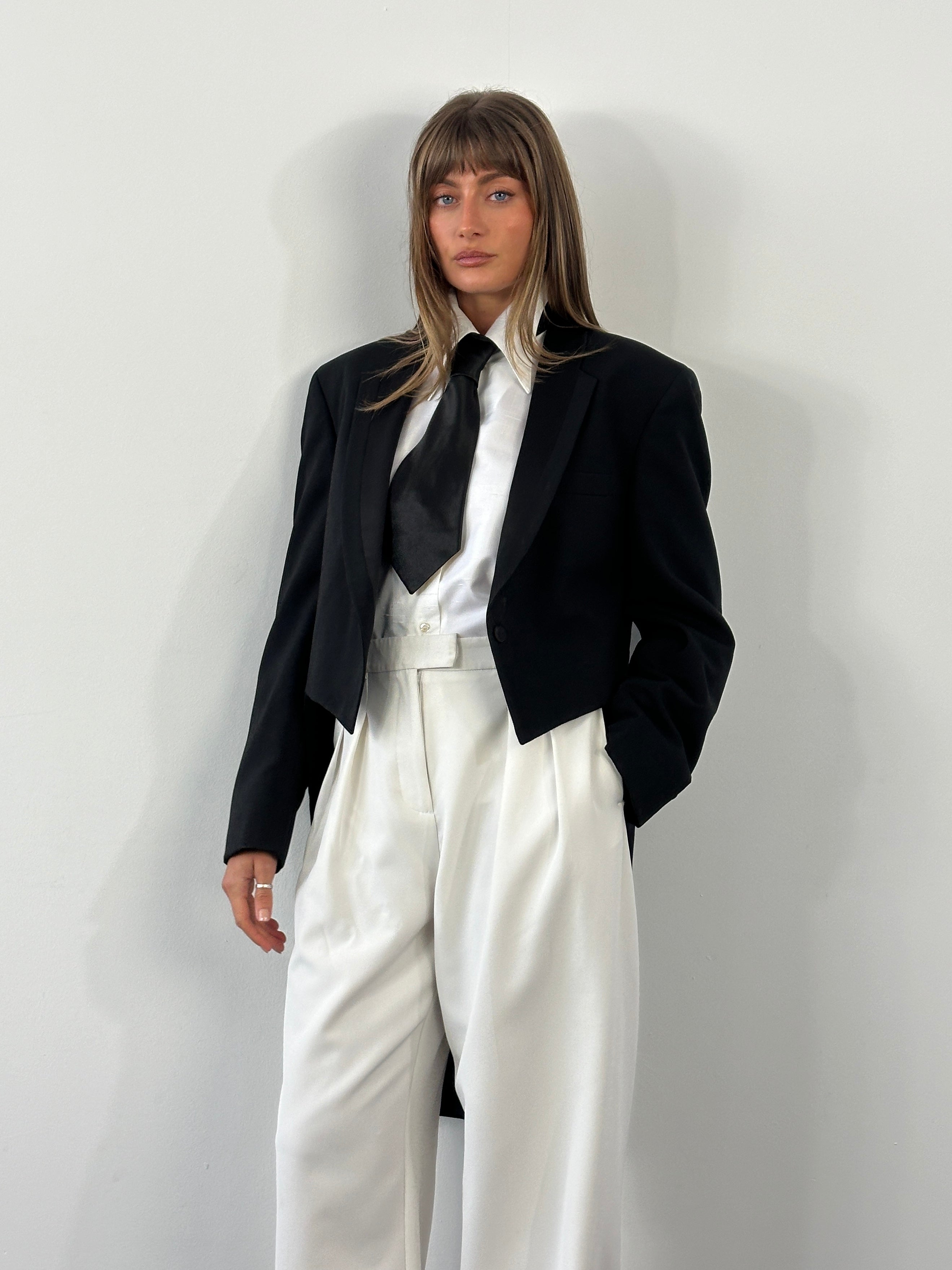 Christian Dior Grand Luxe 1980s tuxedo blazer with wool fabric and satin tailcoat details, size 39R/L, classic vintage style.