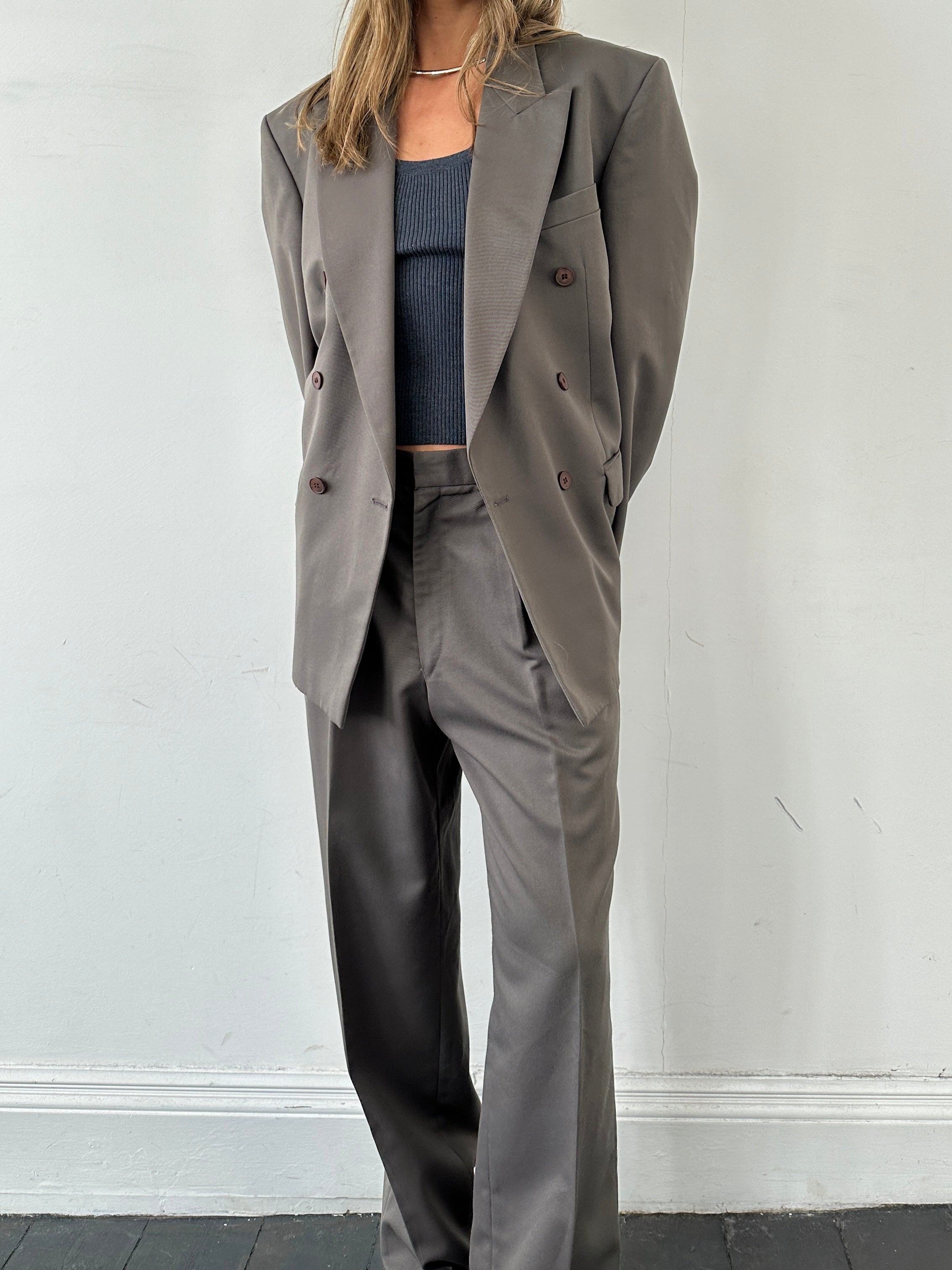 Vintage British double-breasted jumpsuit in size 40R/W32, featuring classic tailored design and vintage fabric details.