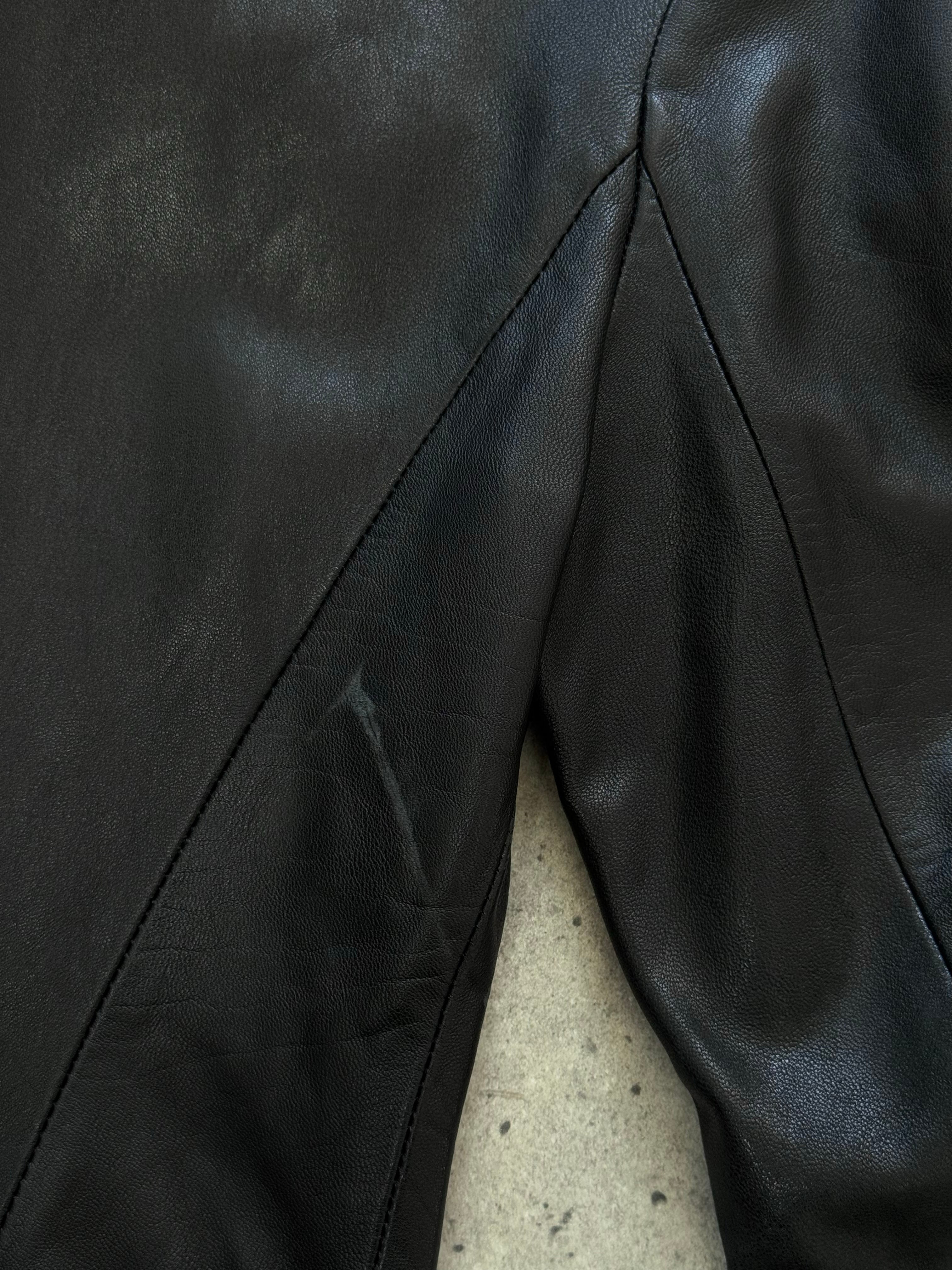 Vintage British 1990s fitted leather jacket, size small, with classic collar and zip front, stylish and timeless leather outerwear.