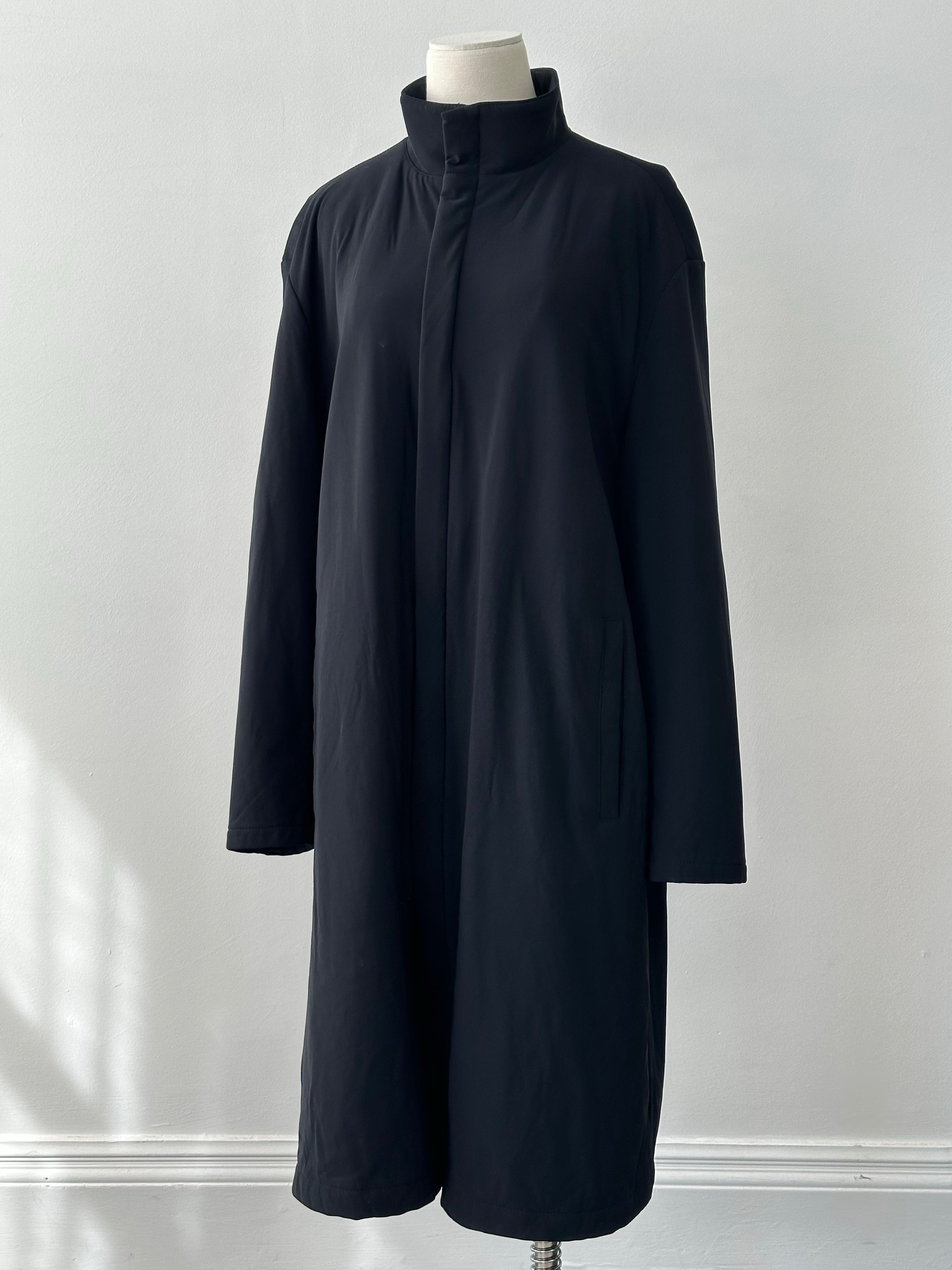 Hugo Boss 2000s cotton high-neck double zip trench coat in size L, shown on a model with beige background.