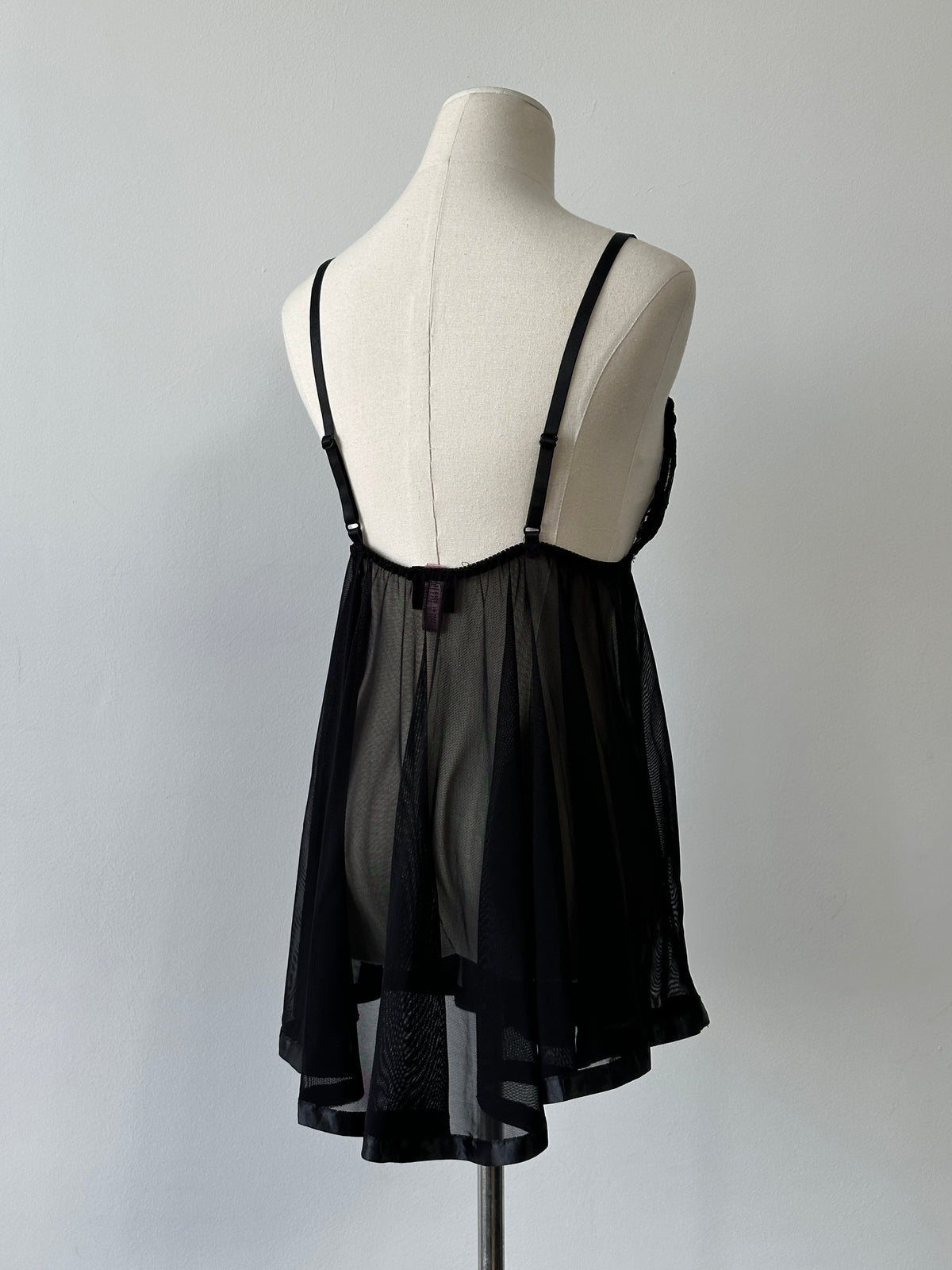 Vintage 2000s sheer lace babydoll top, M-L size, featuring delicate lace fabric and feminine design, styled with thin straps.