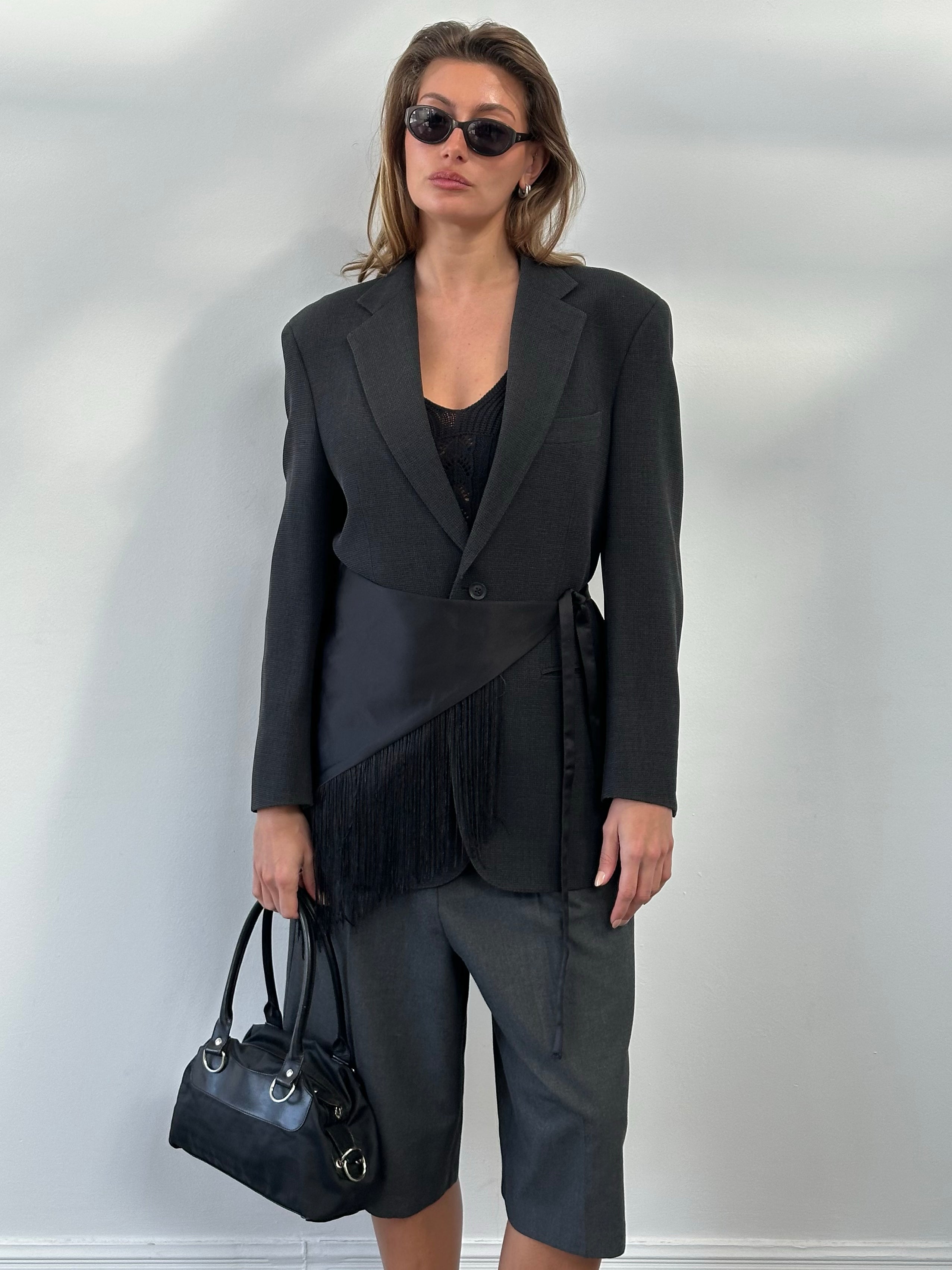 Burberry London 2000s wool single-breasted woven blazer in size M, tailored fit with classic check pattern and structured lapels.