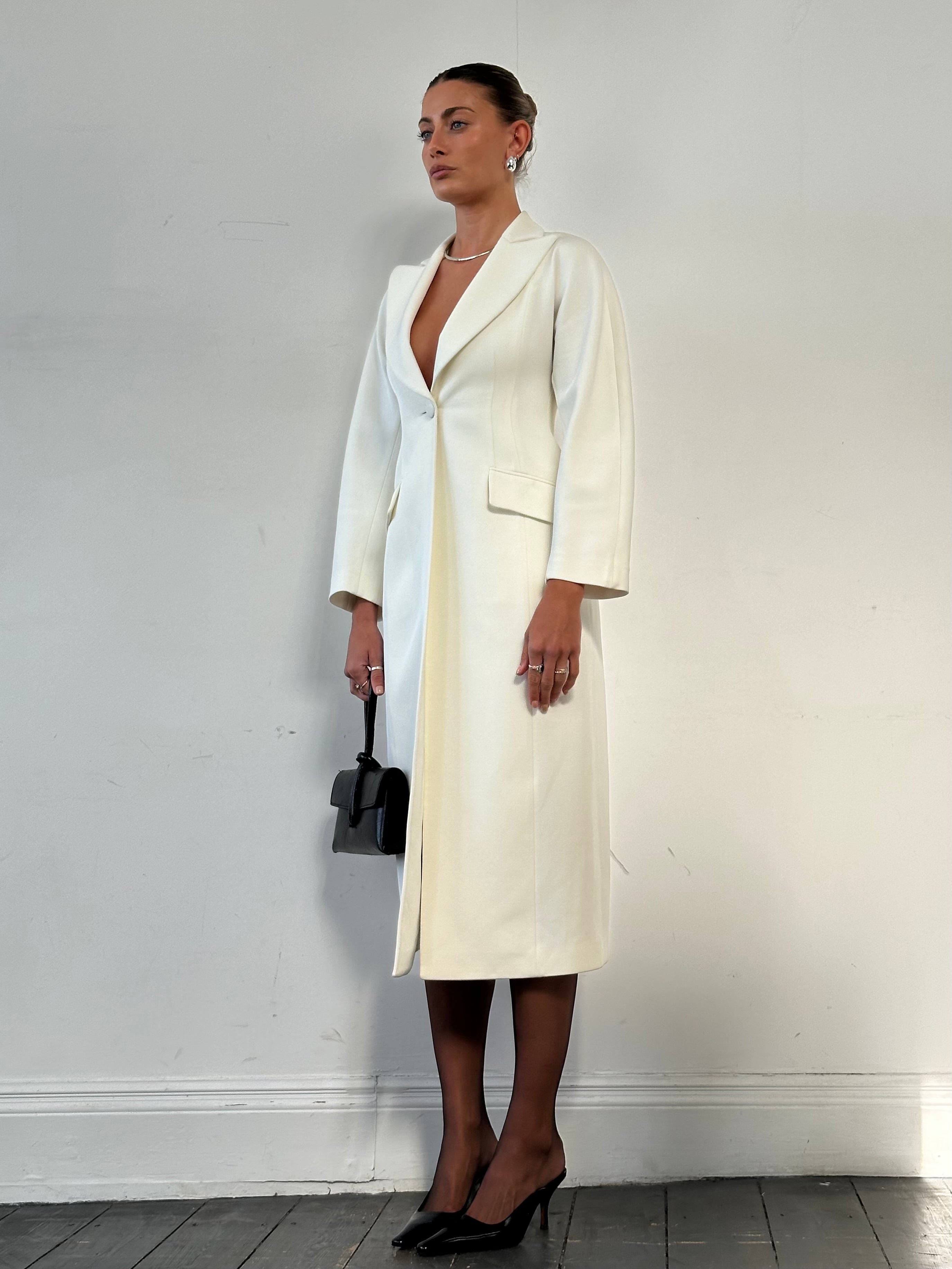 Emporio Armani wool blend fitted coat in size S, stylish coat with tailored fit and classic design, shown on model.
