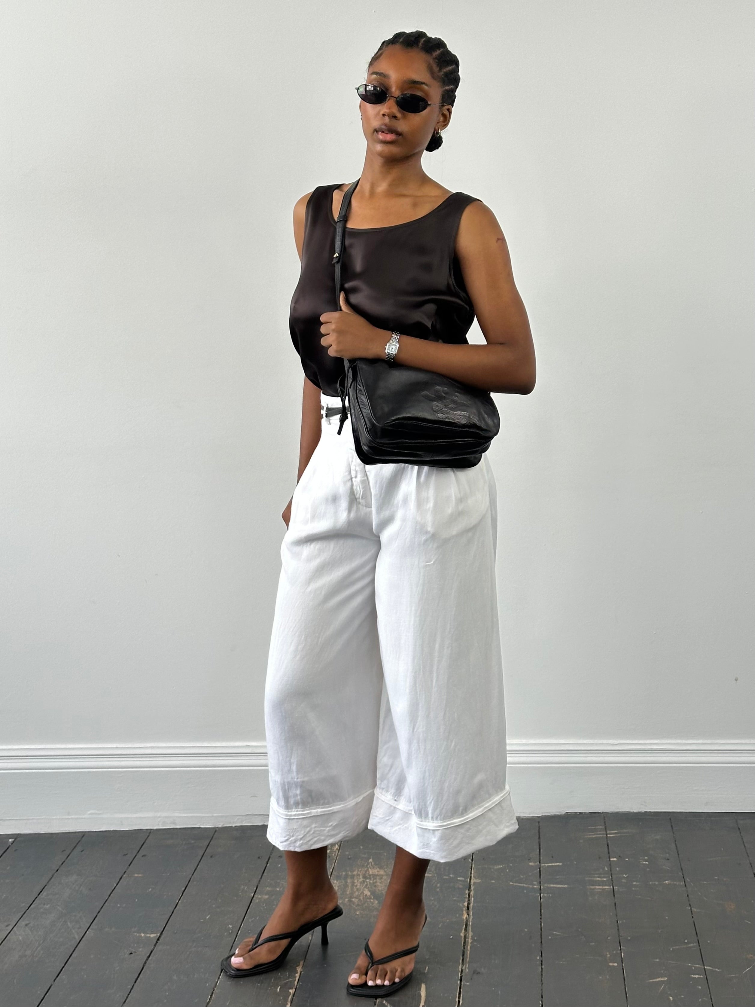Vintage Japanese 1990s high waisted wide-leg culottes shorts with W26 waist, showcasing retro style and wide-leg fit.