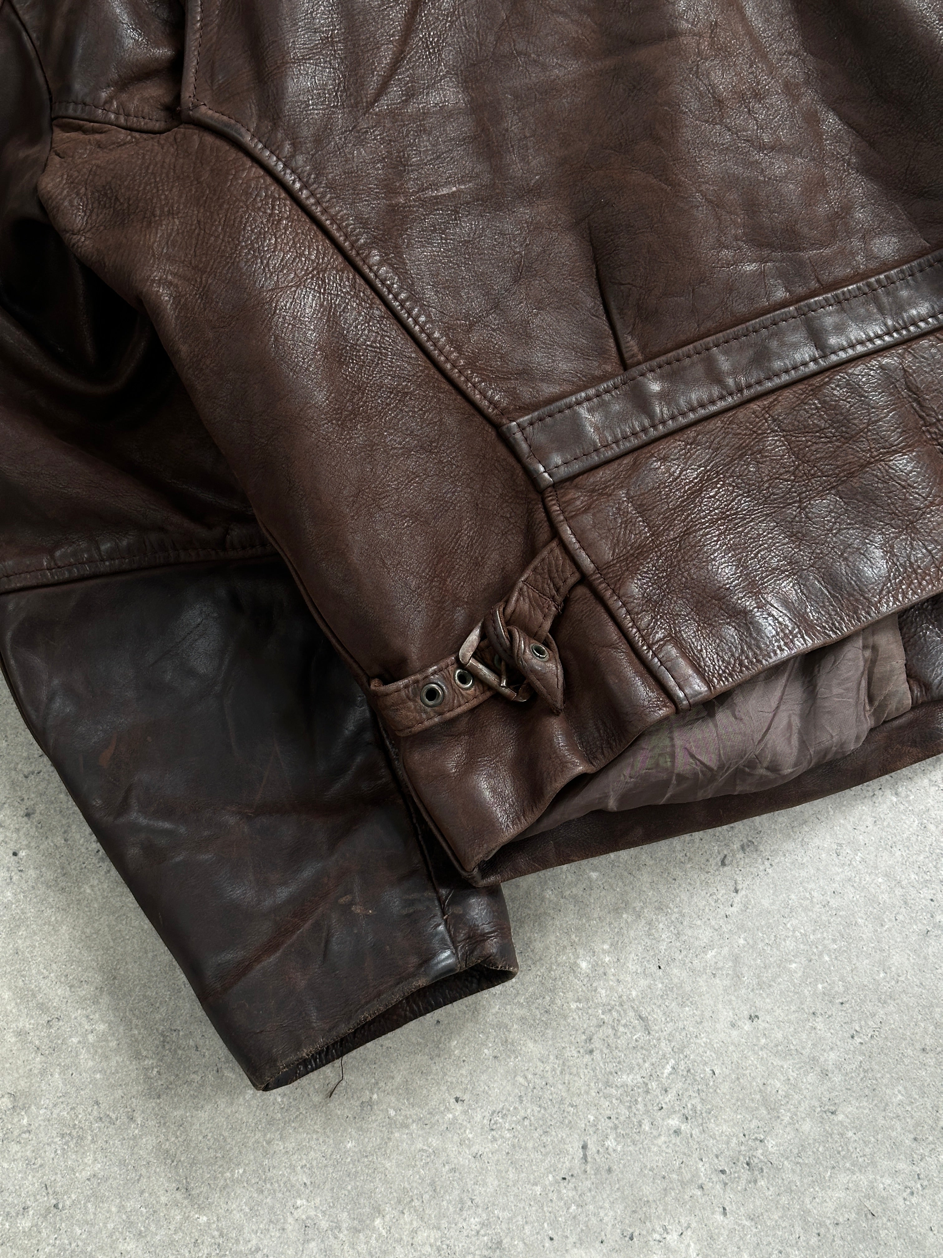 Vintage French 1980s aged boxy leather jacket in black, classic design with worn leather texture, size L.
