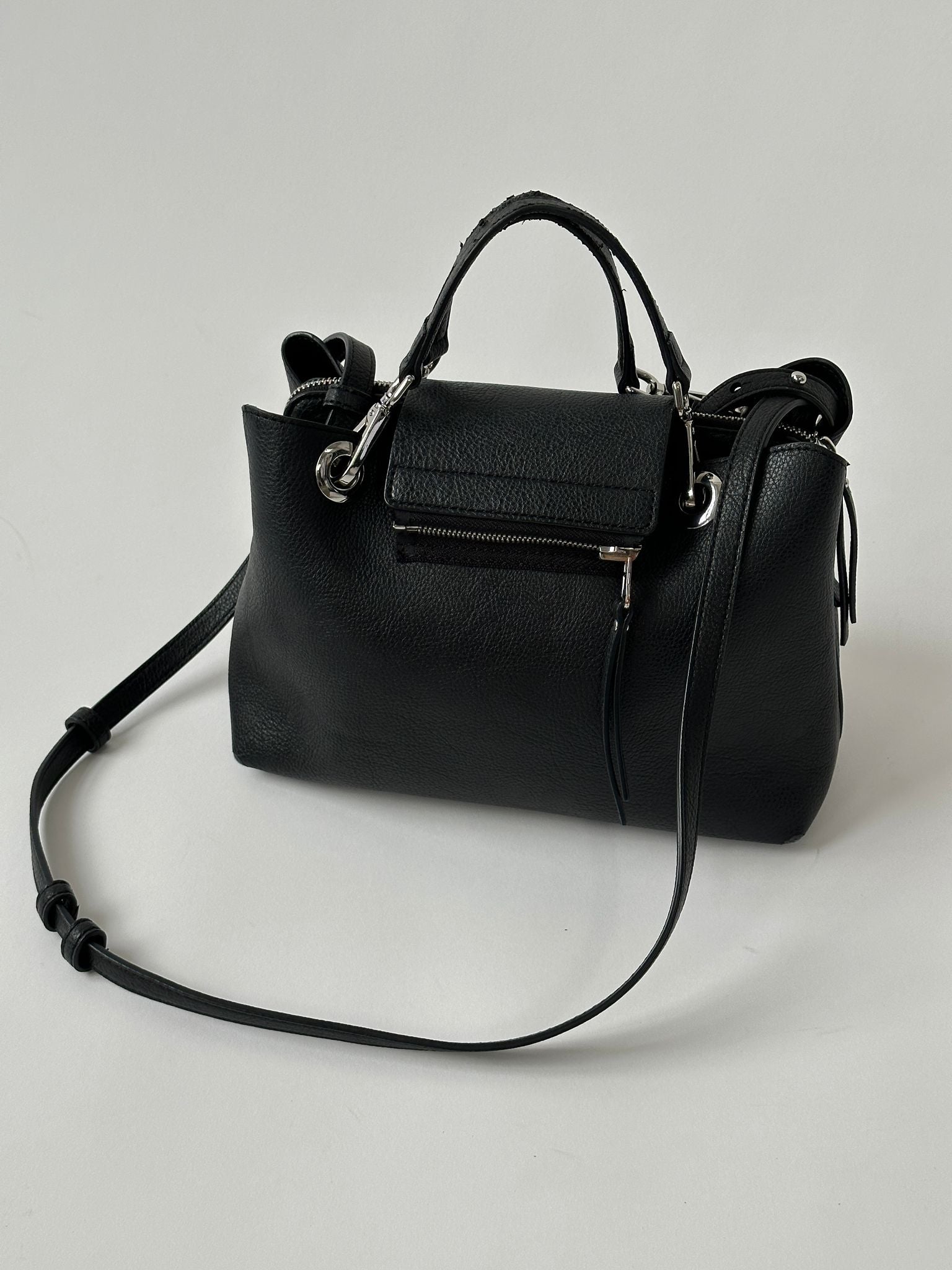 Tommy Hilfiger crossbody bag with adjustable strap, navy fabric, and logo detail for a stylish casual look.