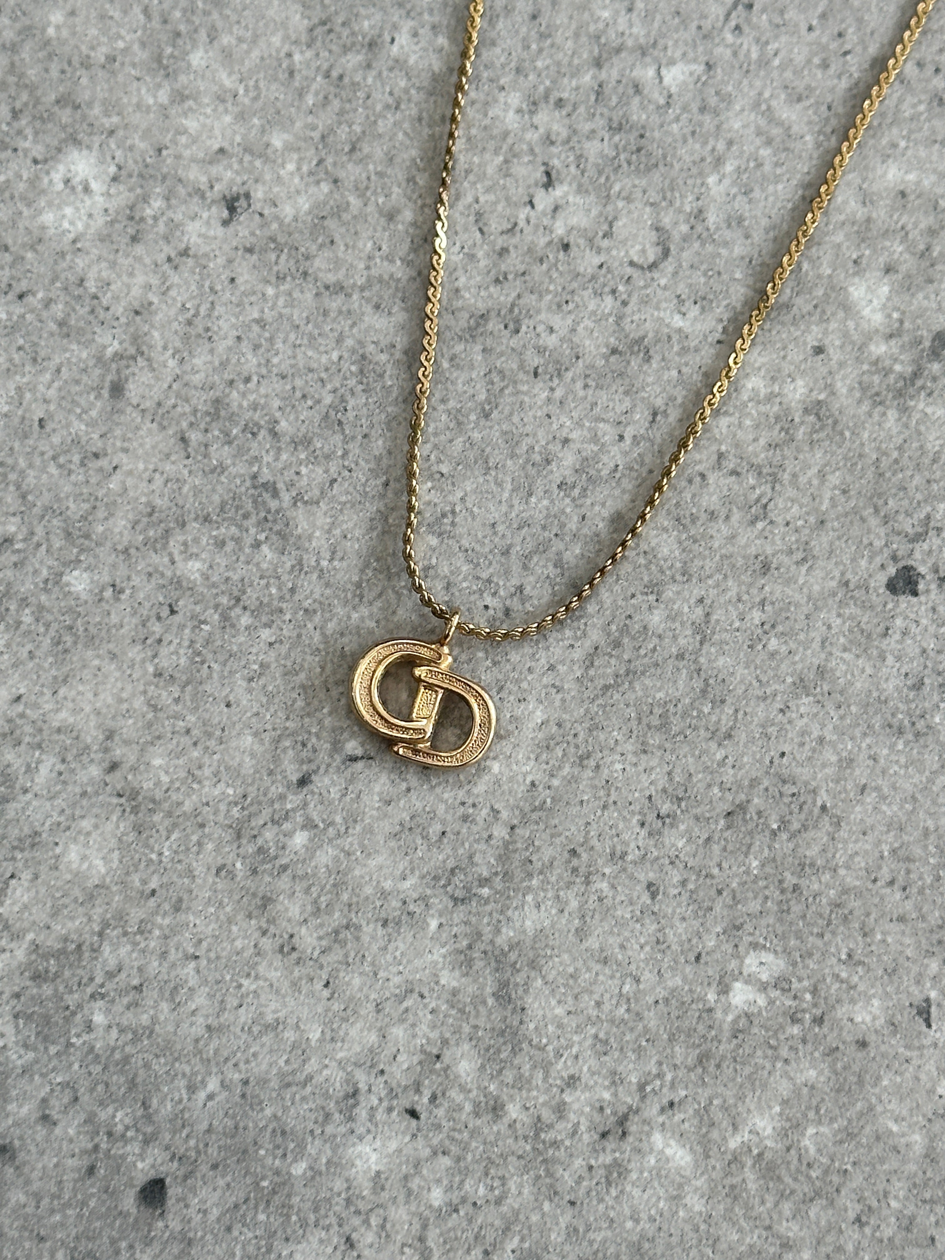 Christian Dior 1990s gold plated CD logo pendant necklace, 16-inch chain with detailed Dior branding and classic design.