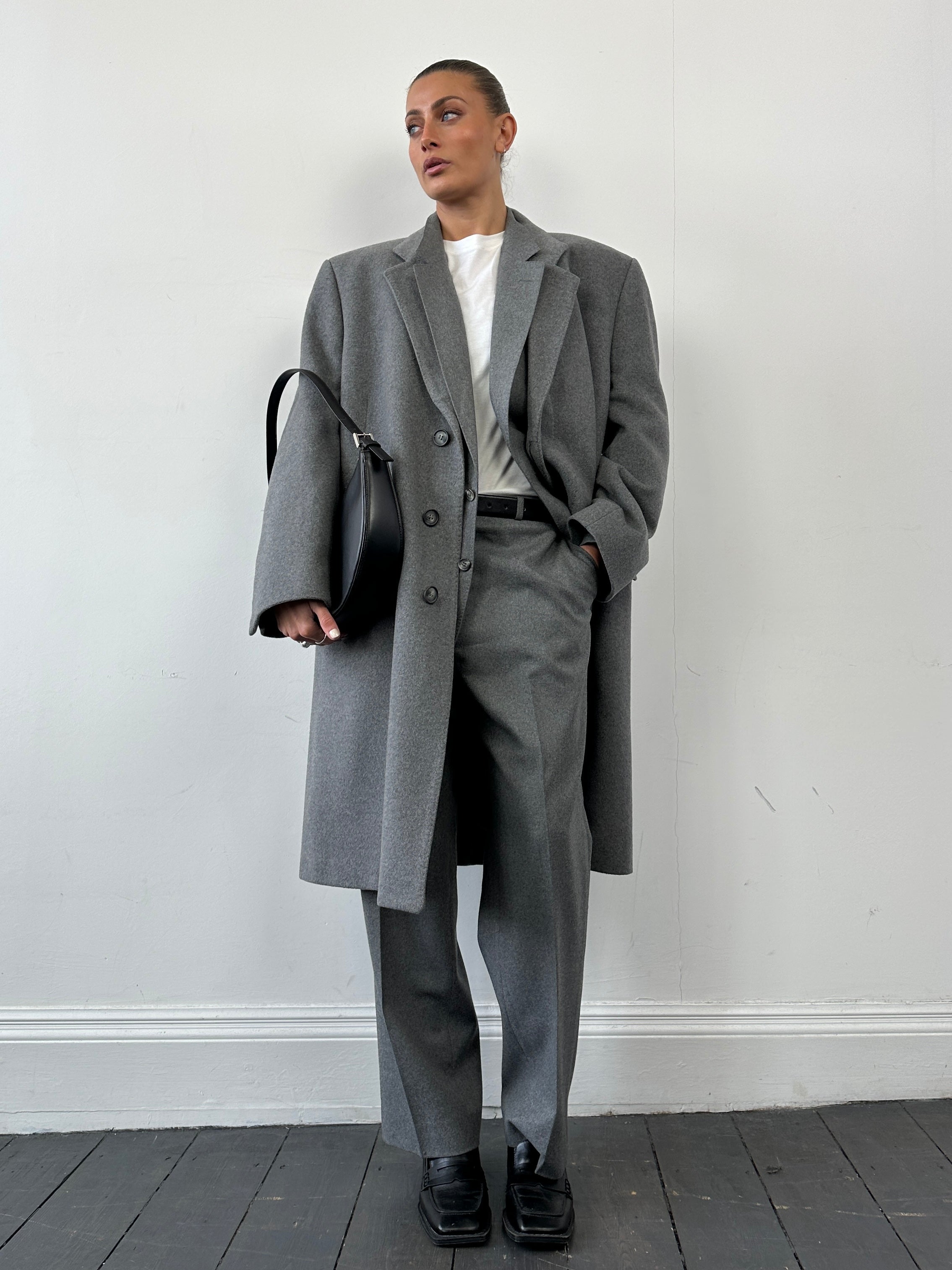 Christian Dior pure wool single-breasted jumpsuit in size 44R/W32, shown in a tailored, elegant fit with lapel details.