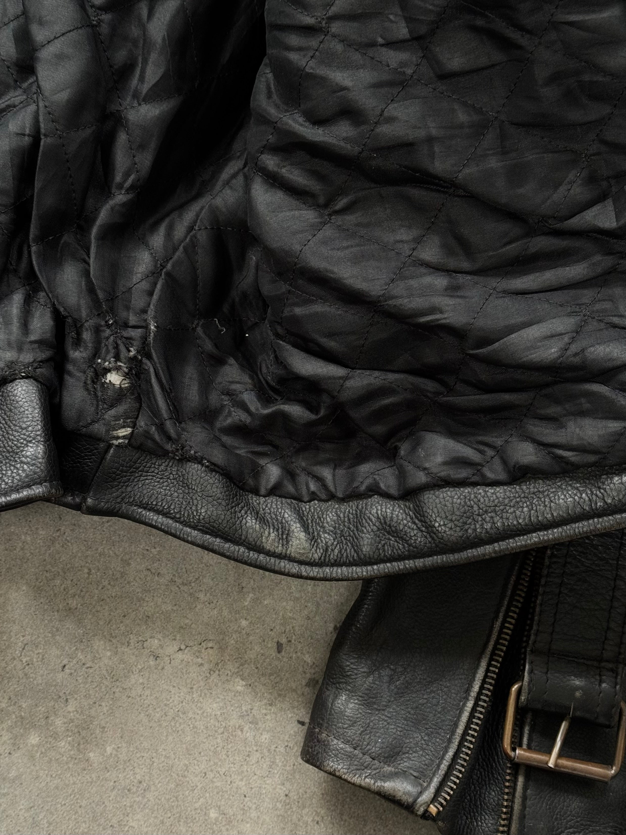 Vintage 1990s leather biker jacket in size M/L, featuring classic distressed leather and rugged style.