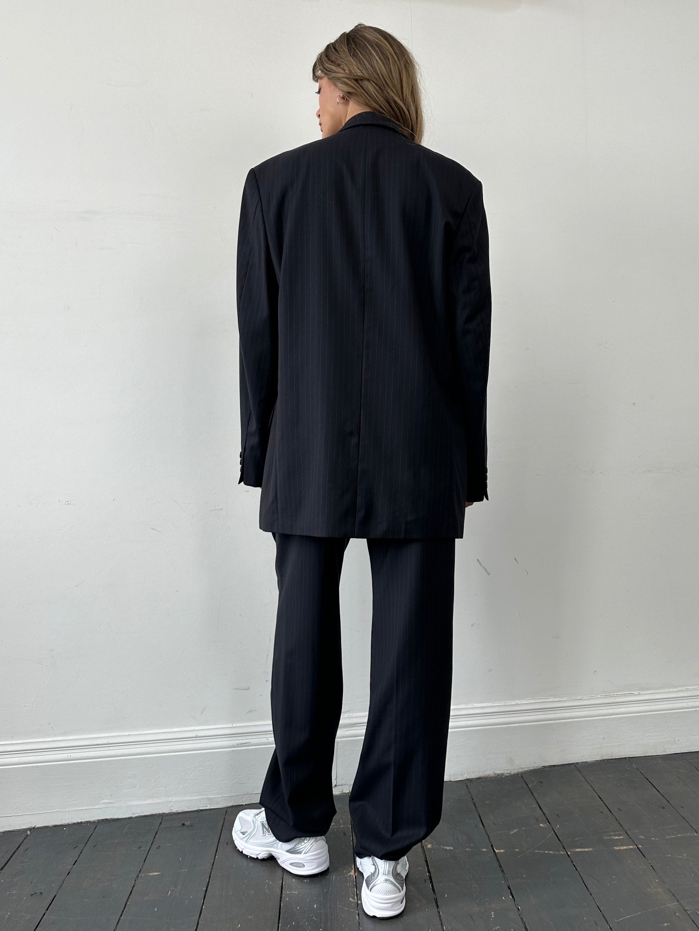 Balmain pinstripe pure wool jumpsuit with single-breasted design, size 40L/W32, featuring a tailored fit and elegant style.