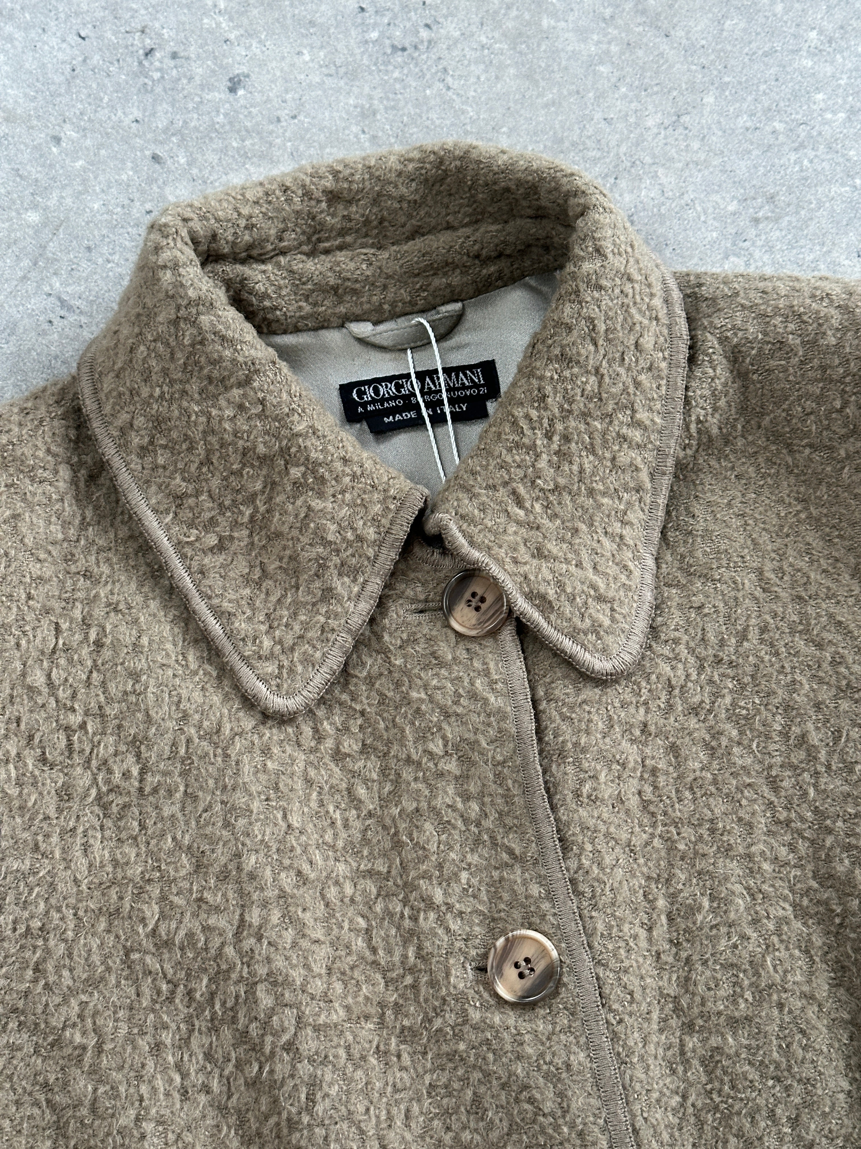 Giorgio Armani 1990s wool single-breasted coat in size M, classic tailored design with lapel collar and button closure.