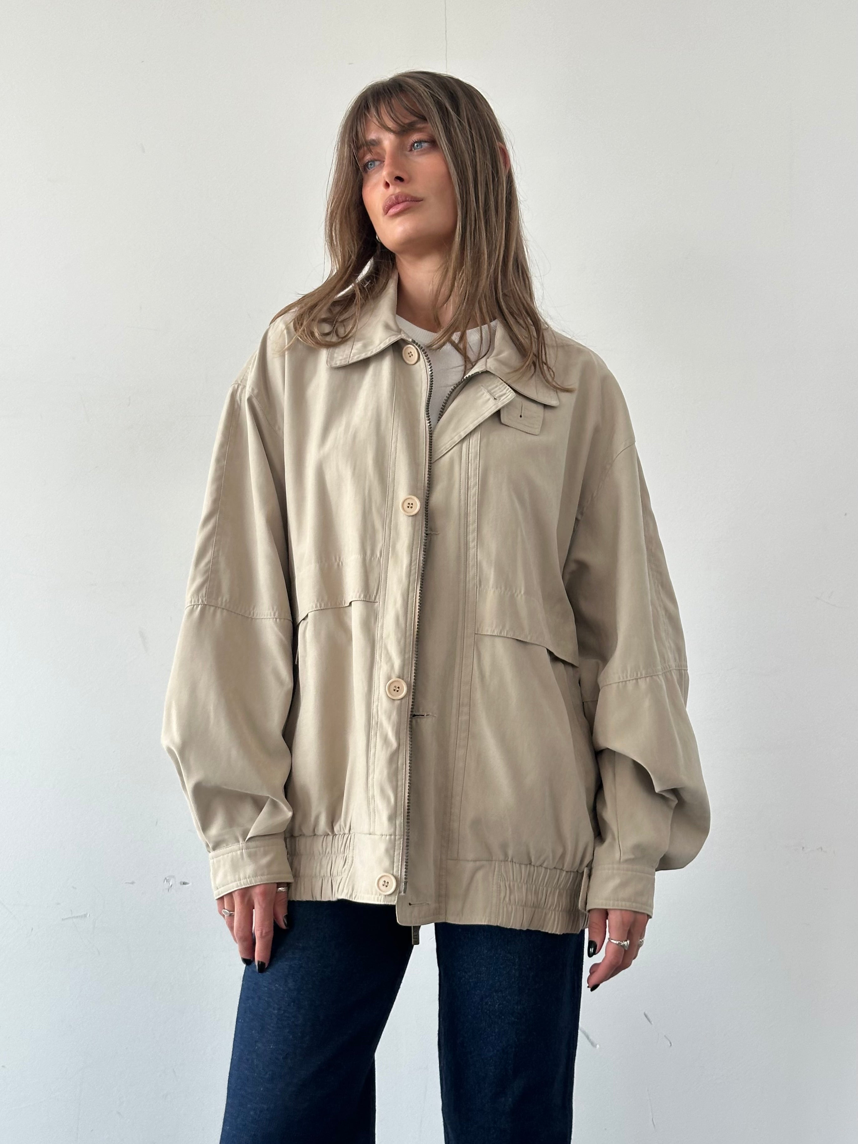 Vintage micro satin bomber jacket in XXL with a classic design, featuring a smooth, shiny fabric and ribbed cuffs.