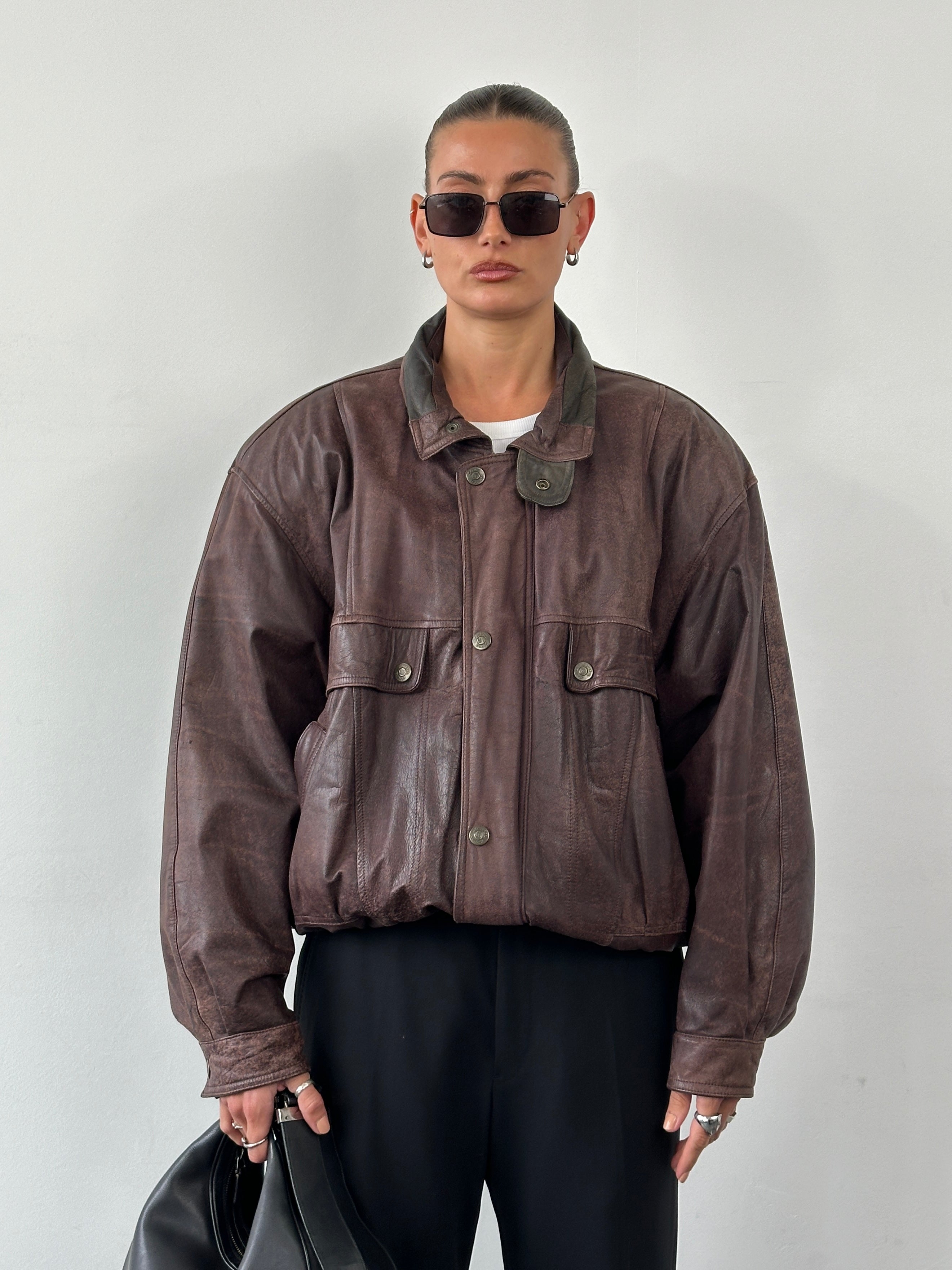 Vintage high neck mottled leather bomber jacket in XL, showcasing textured leather and classic silhouette.