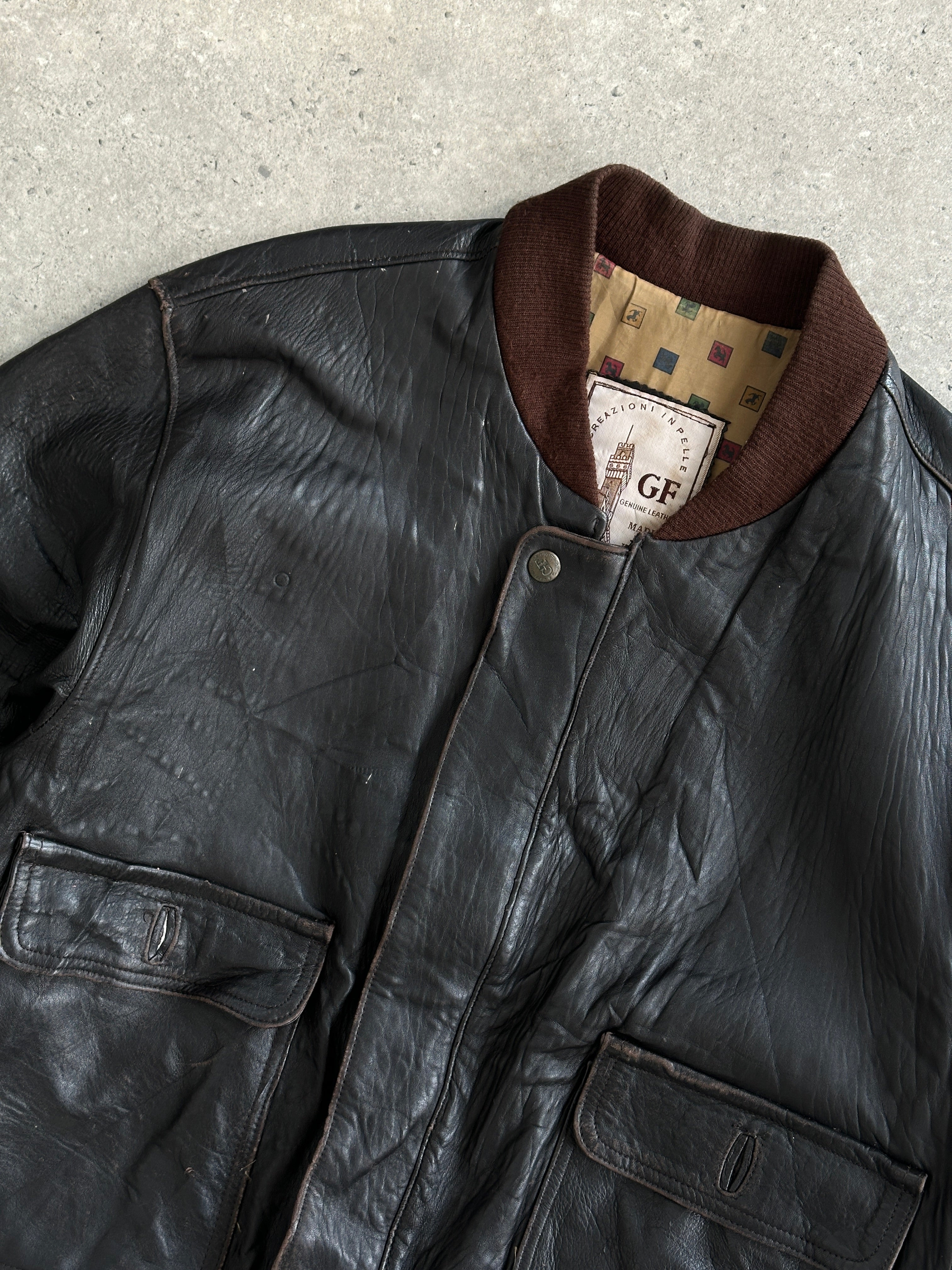 Vintage Italian vintage aged leather bomber jacket in XL with classic design and distressed finish, showcasing rugged style and craftsmanship.