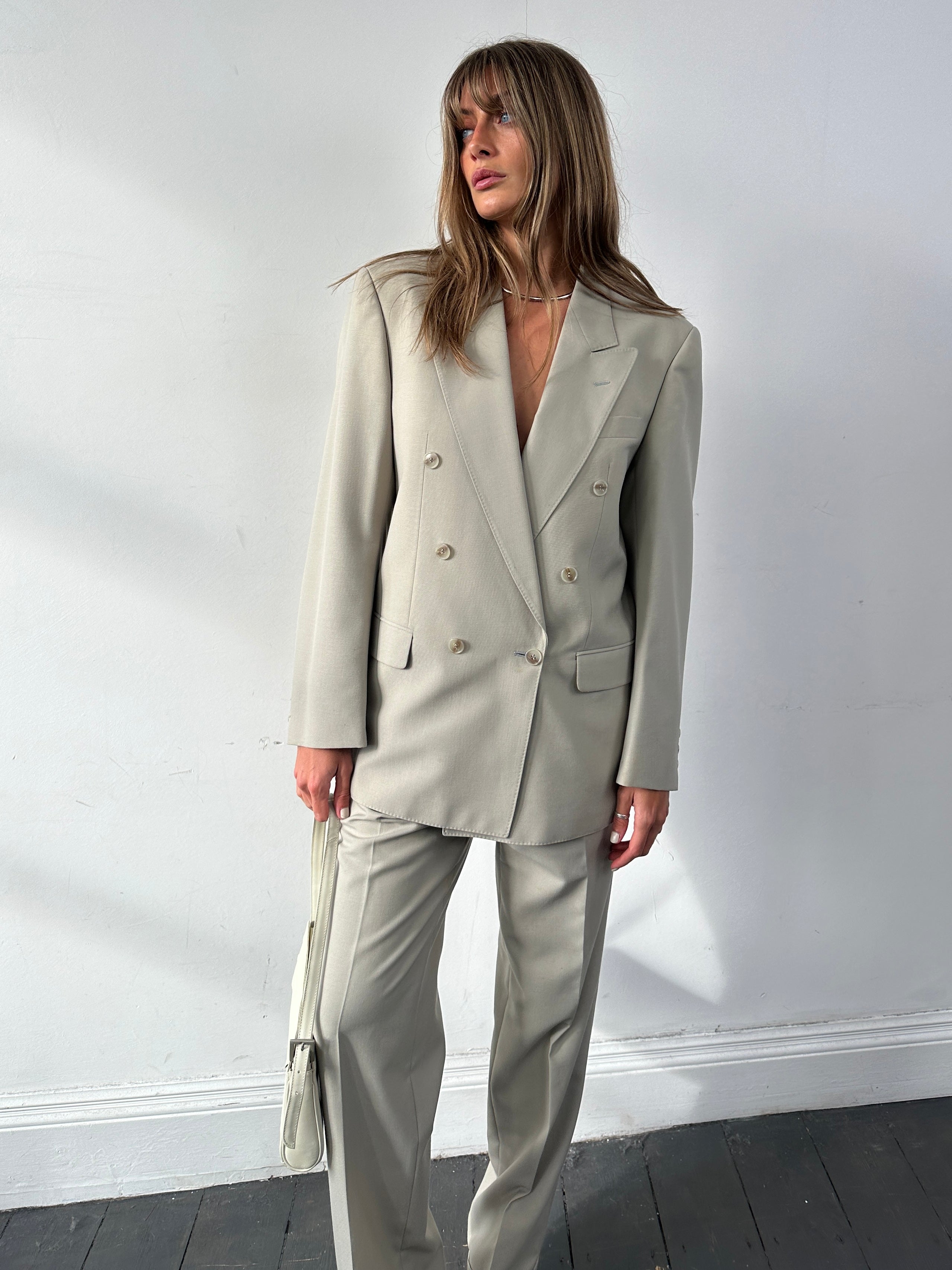 Vintage wool double-breasted jumpsuit in size 40R/W30, featuring classic tailoring and a retro-inspired design.