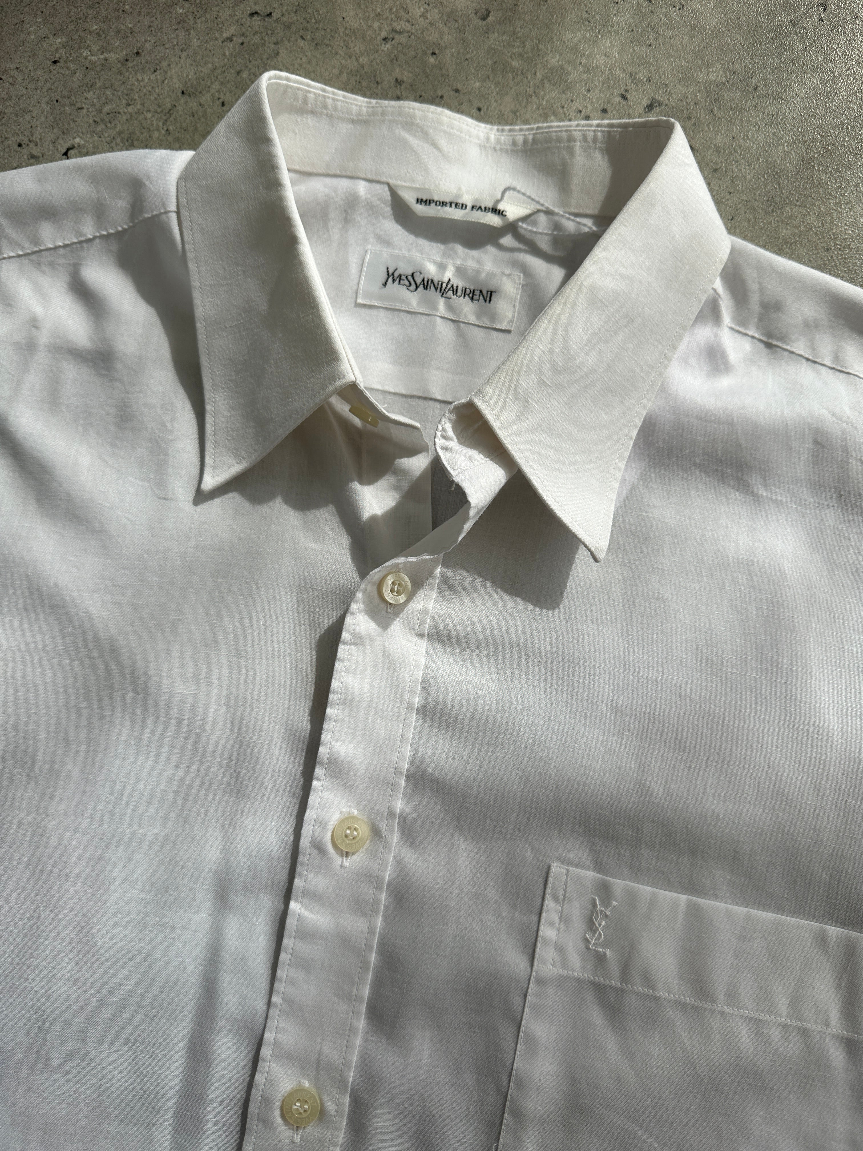 Yves Saint Laurent 90s cotton logo shirt in size L/XL, featuring classic YSL branding and a casual, stylish fit.