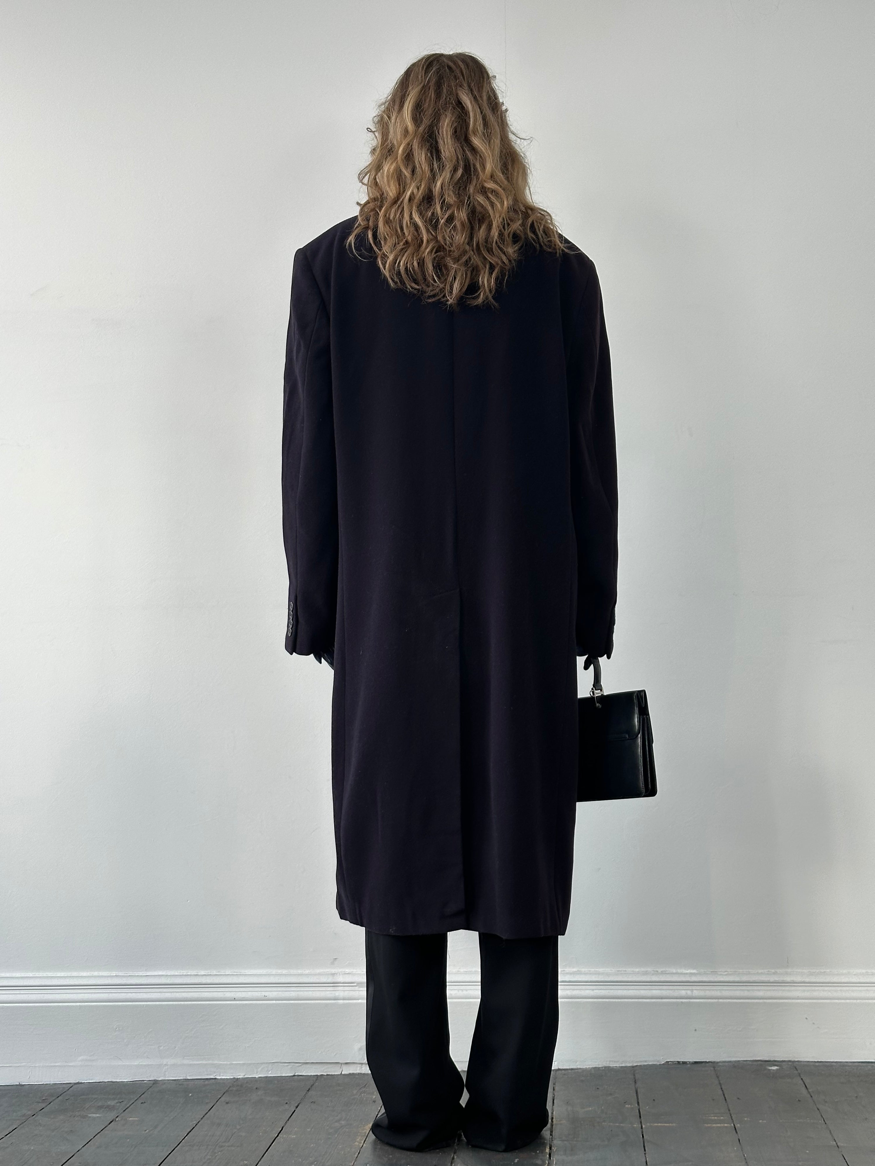 Valentino pure wool single-breasted coat in XL/XXL, stylish black coat shown on a hanger, showcasing classic tailored design.