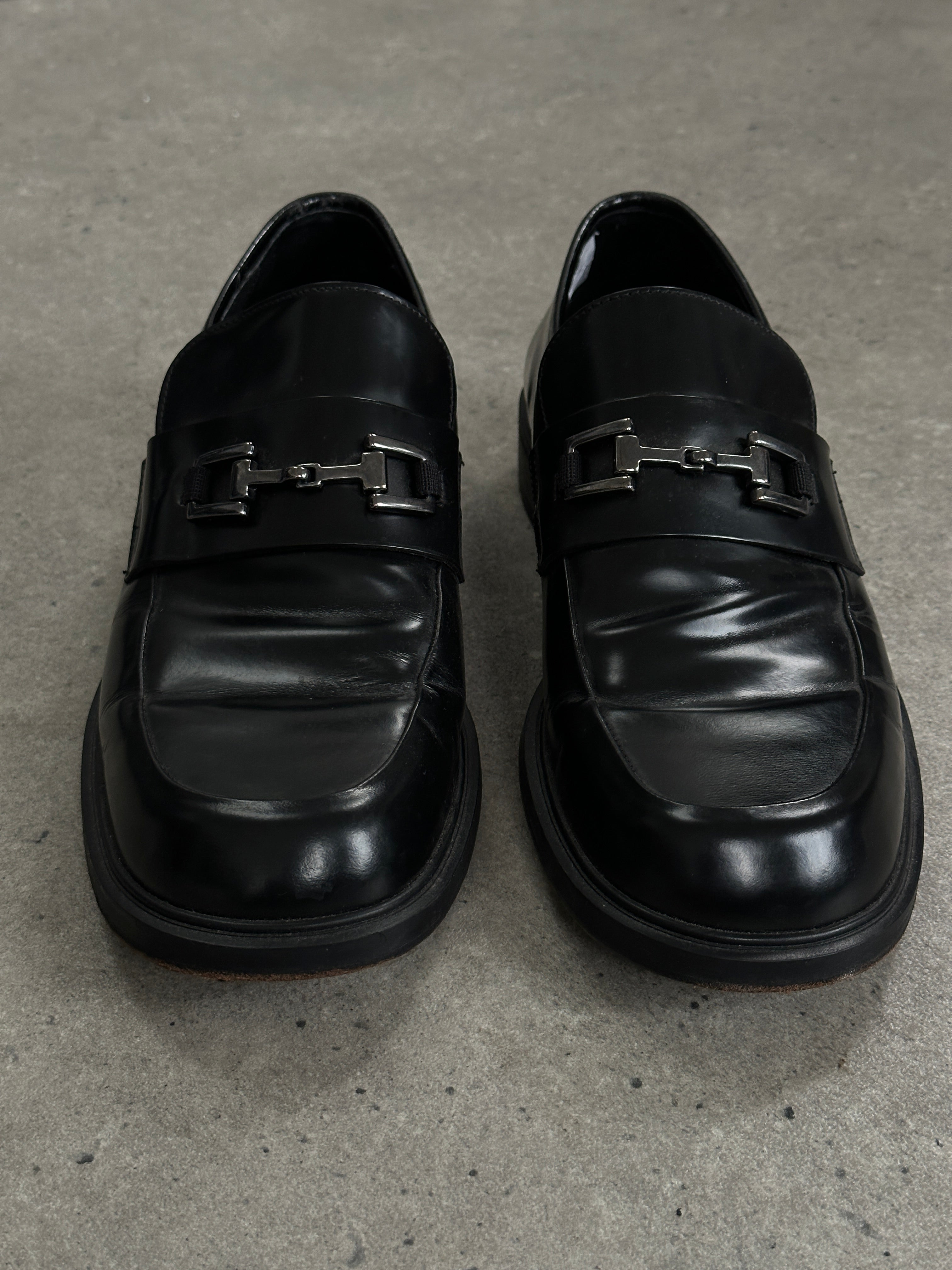 Pierre Cardin leather horsebit loafers in UK size 9, featuring classic design and sleek black leather with gold horsebit detail.