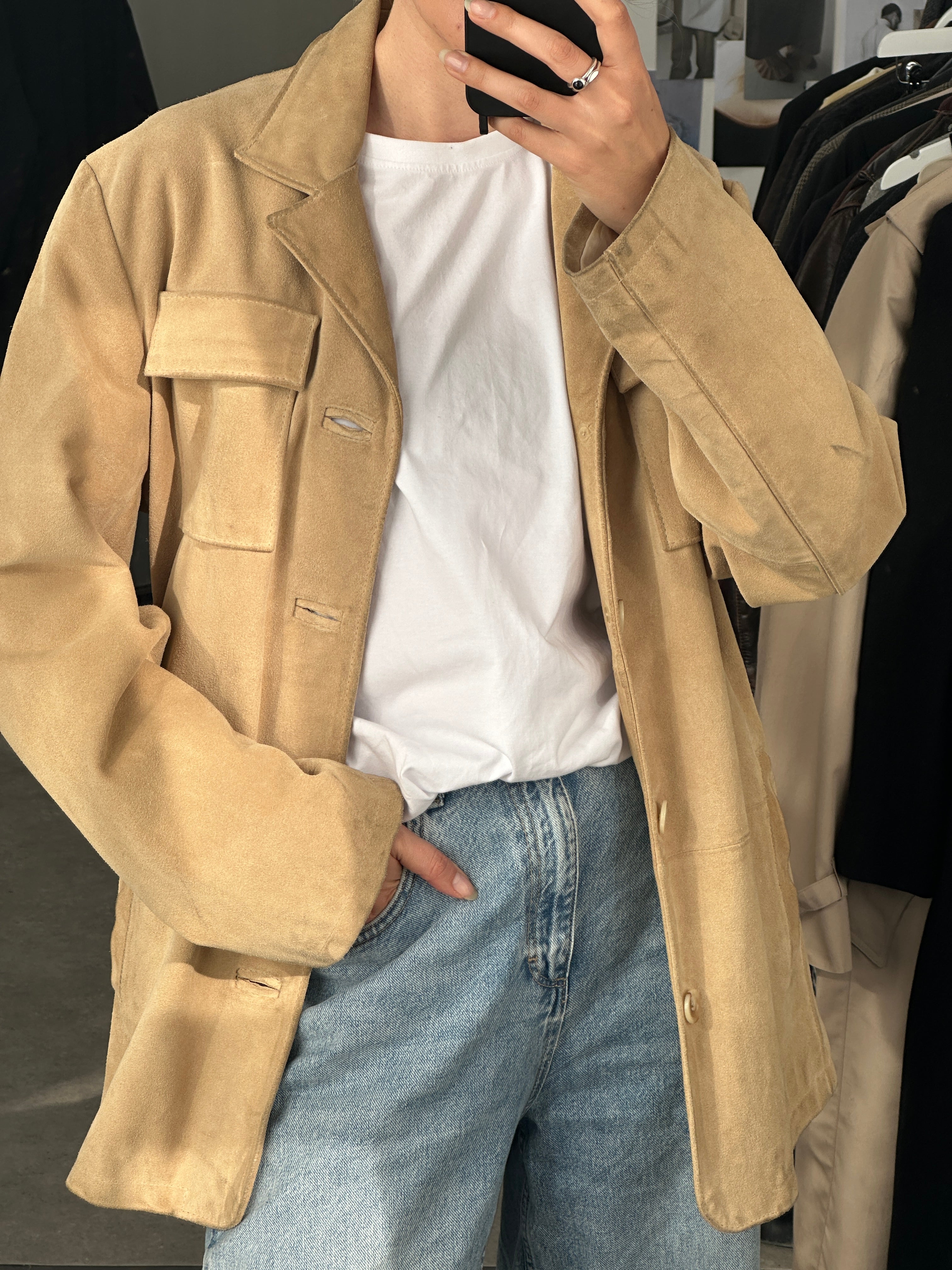 Vintage Italian suede jacket in size large, featuring classic style and soft texture, worn by a model on a city street.