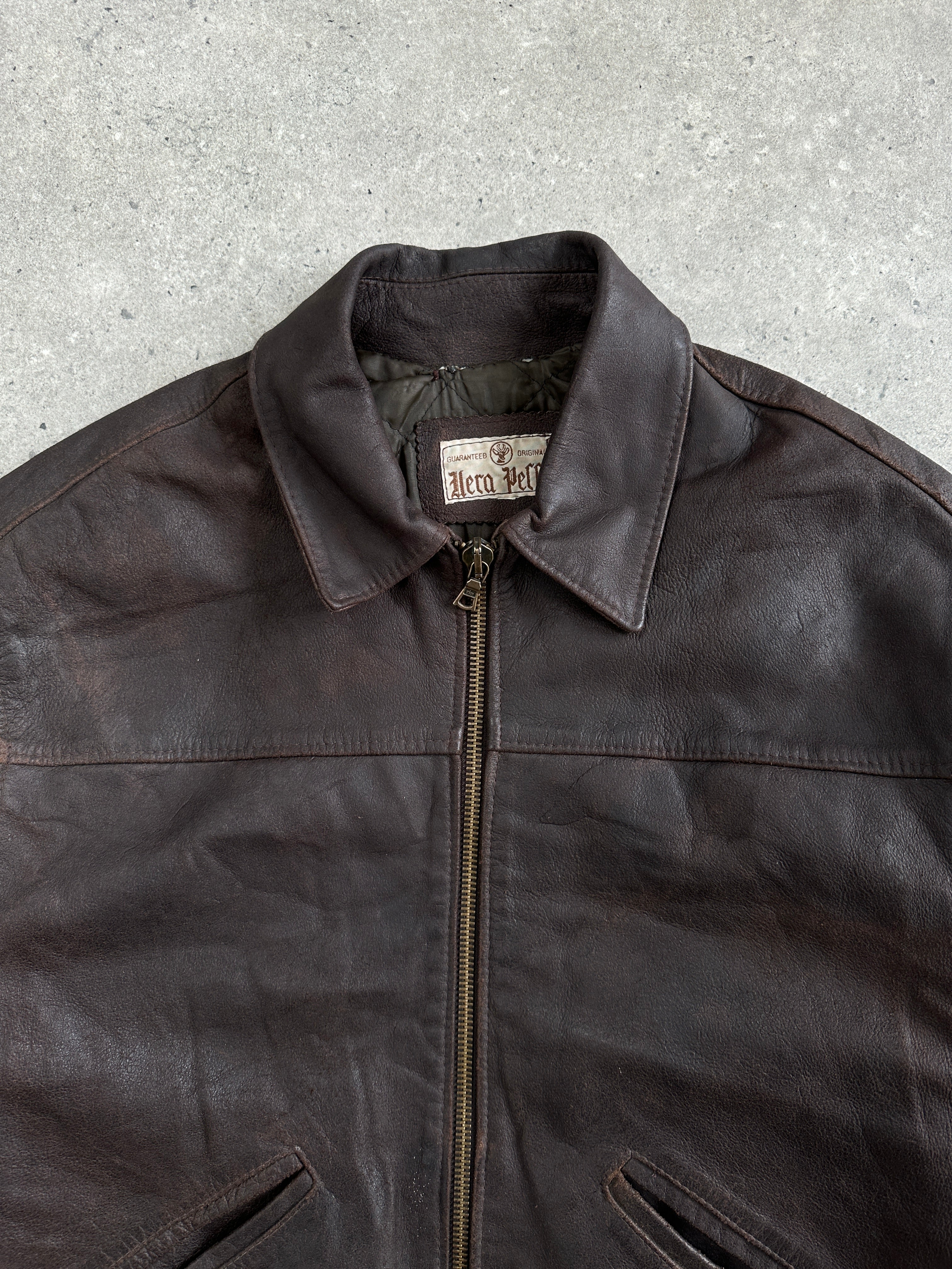 Vintage 1980s cropped leather jacket in size large, featuring classic design and authentic distressed leather.