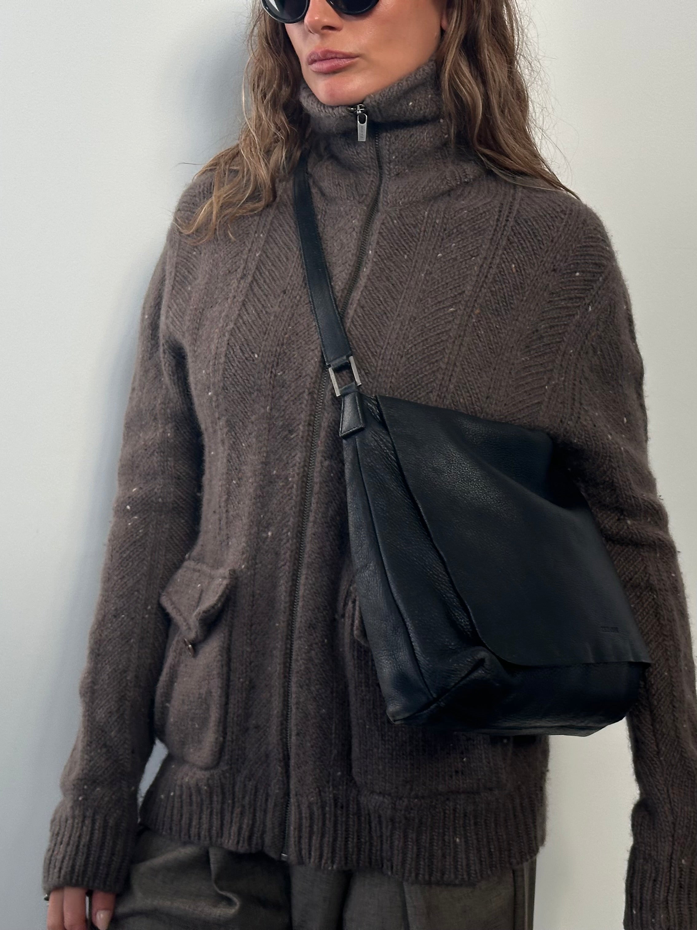 Giorgio Armani 2000s leather crossbody bag with sleek design, featuring a smooth leather surface and adjustable strap.