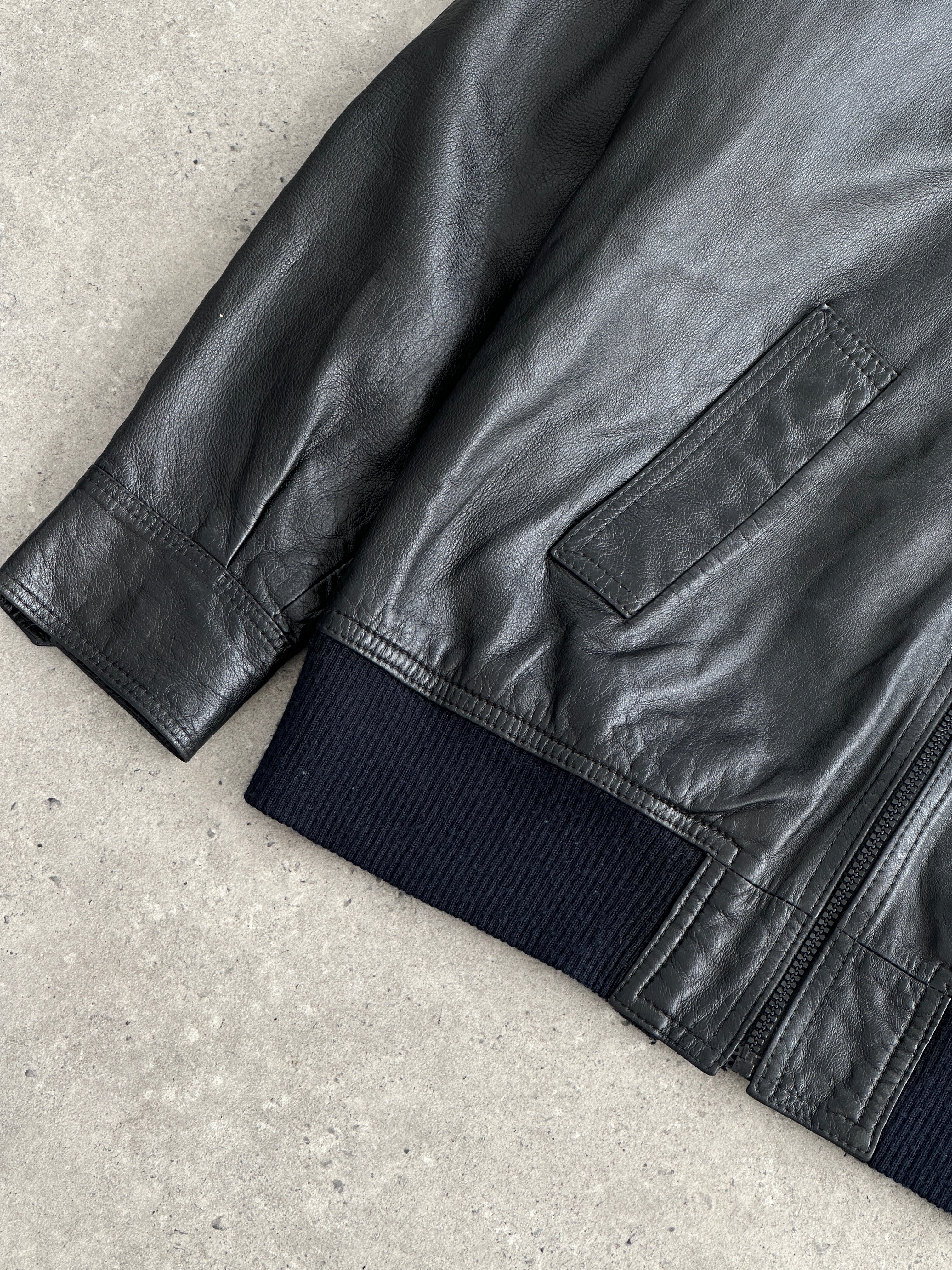 Vintage leather bomber jacket with dagger collar details, size large, featuring classic vintage style and durable craftsmanship.