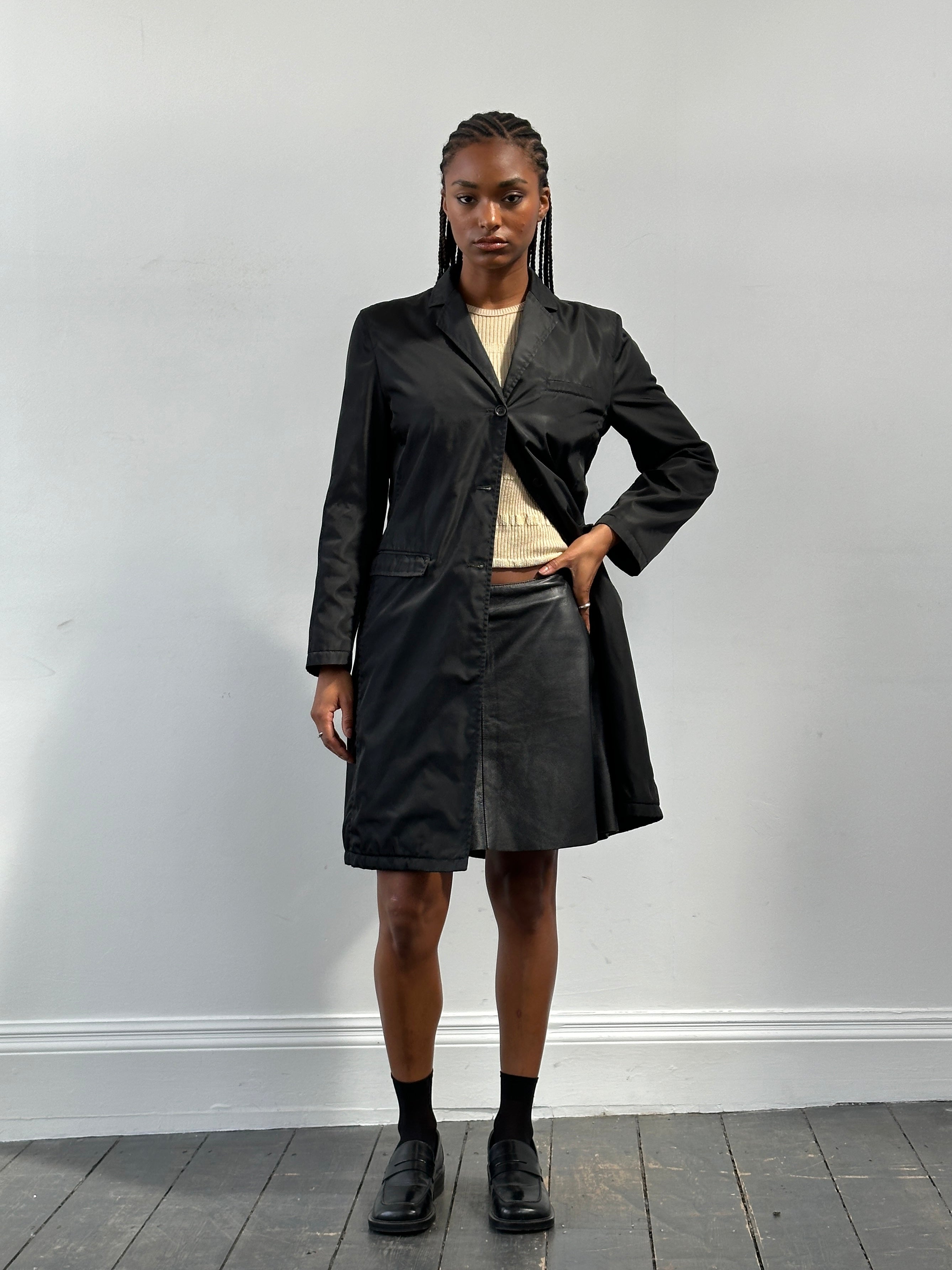 Pinko Italian leather A-line skirt in pink, showcasing a smooth texture and stylish silhouette. W30 size.