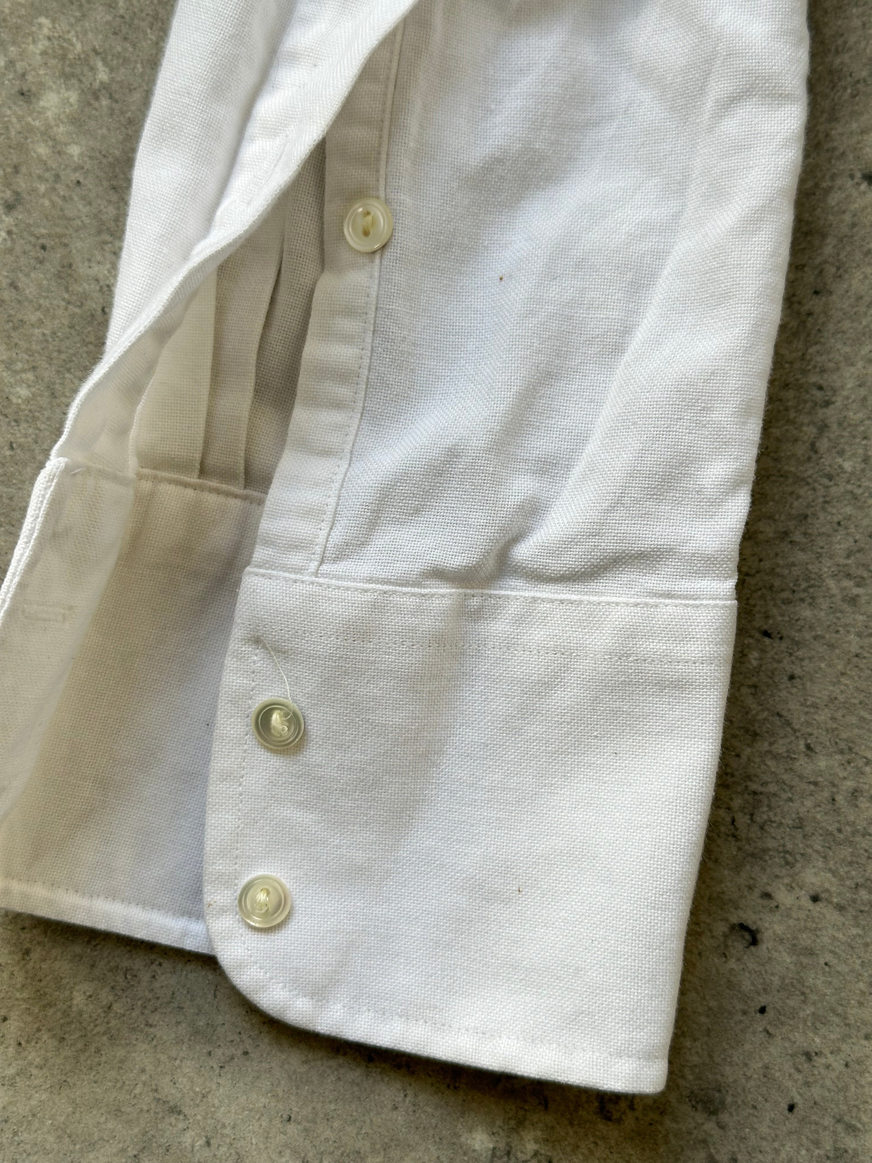 Yves Saint Laurent 1990s pure cotton shirt in size L, featuring classic design and soft fabric, displayed on a hanger.