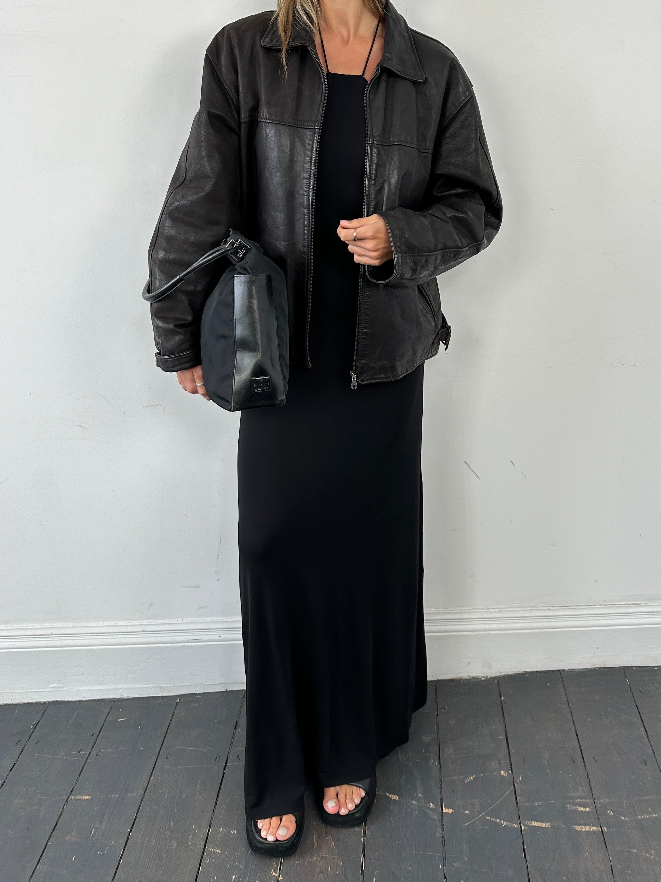 Italian vintage leather jacket in size L, featuring classic design and rich leather texture, styled for a timeless look.
