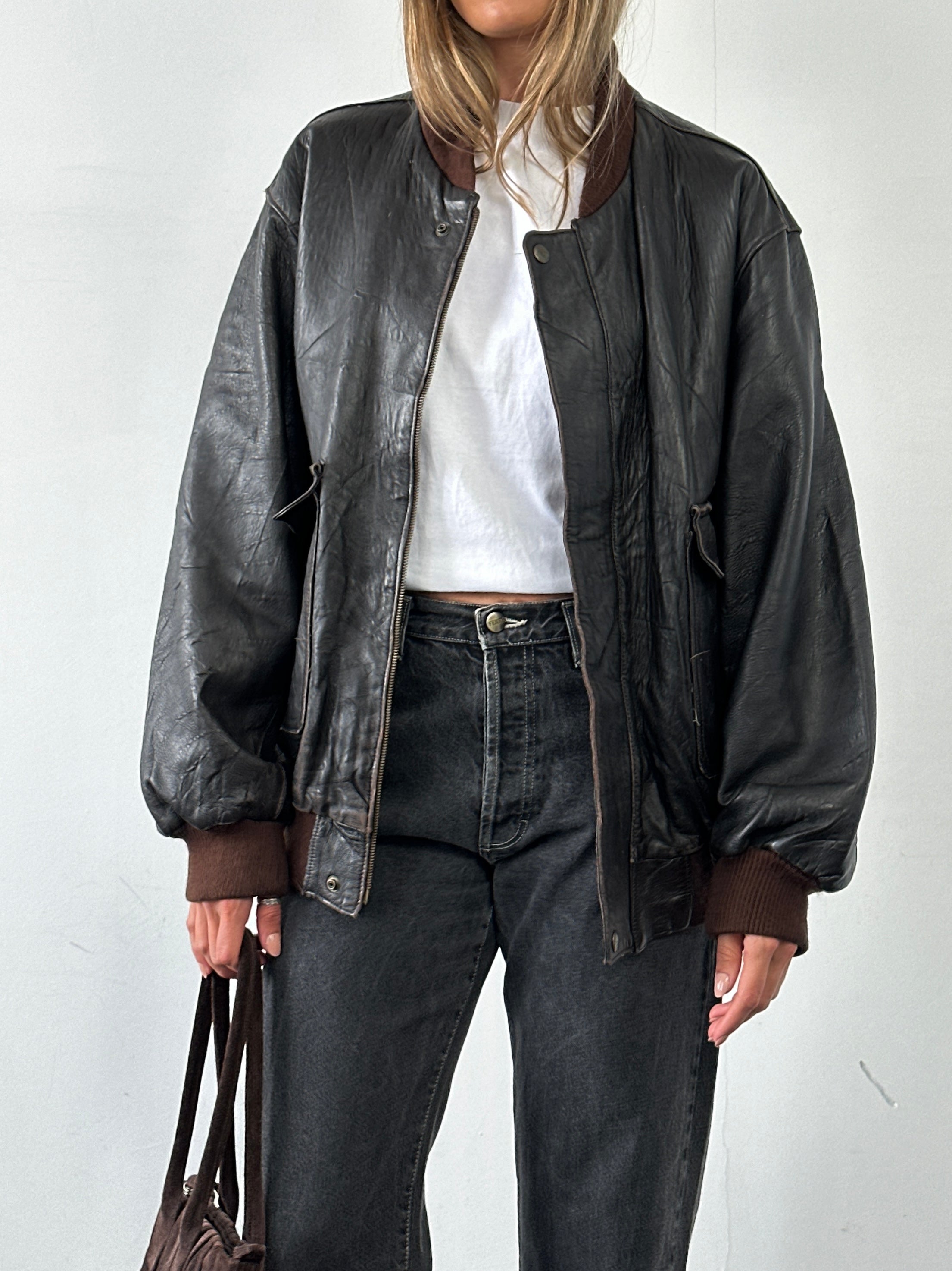 Vintage Italian vintage aged leather bomber jacket in XL, featuring classic design and rich textured leather.