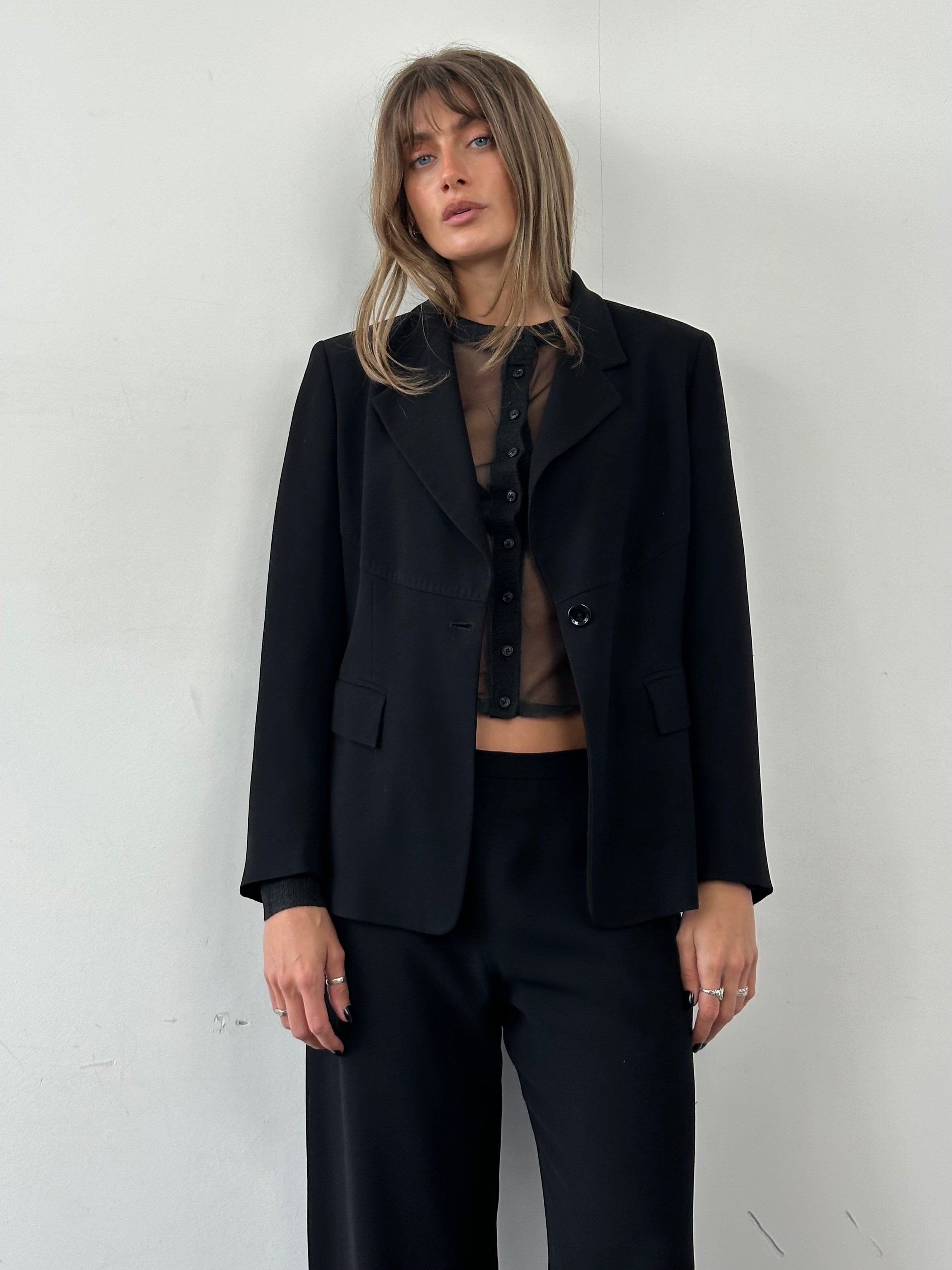 Max Mara minimal single-breasted jumpsuit in sleek fabric, featuring a tailored fit and classic design.