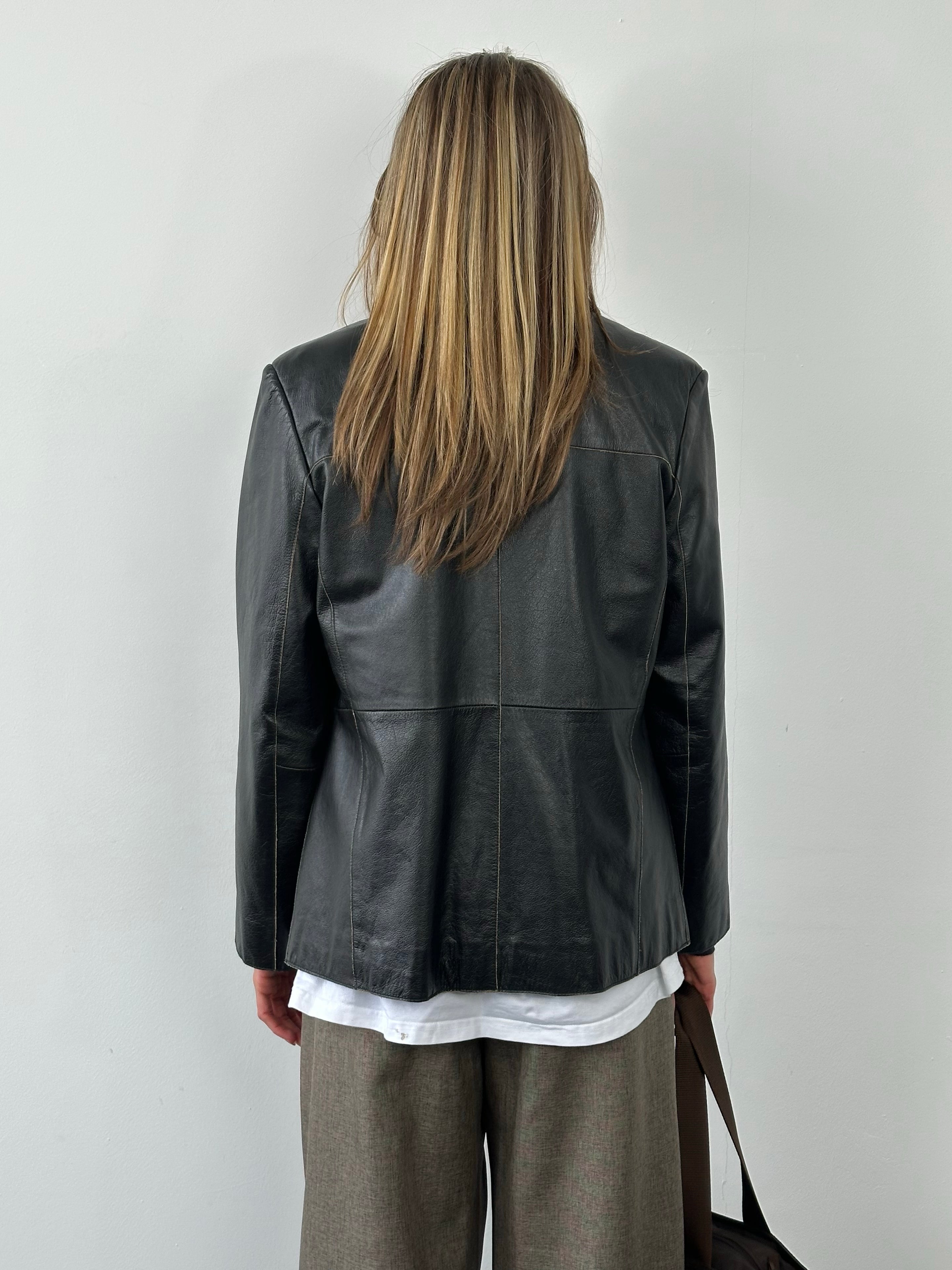 Vintage 1990s leather belted jacket, size small, featuring classic brown leather with a tailored fit and vintage style details.