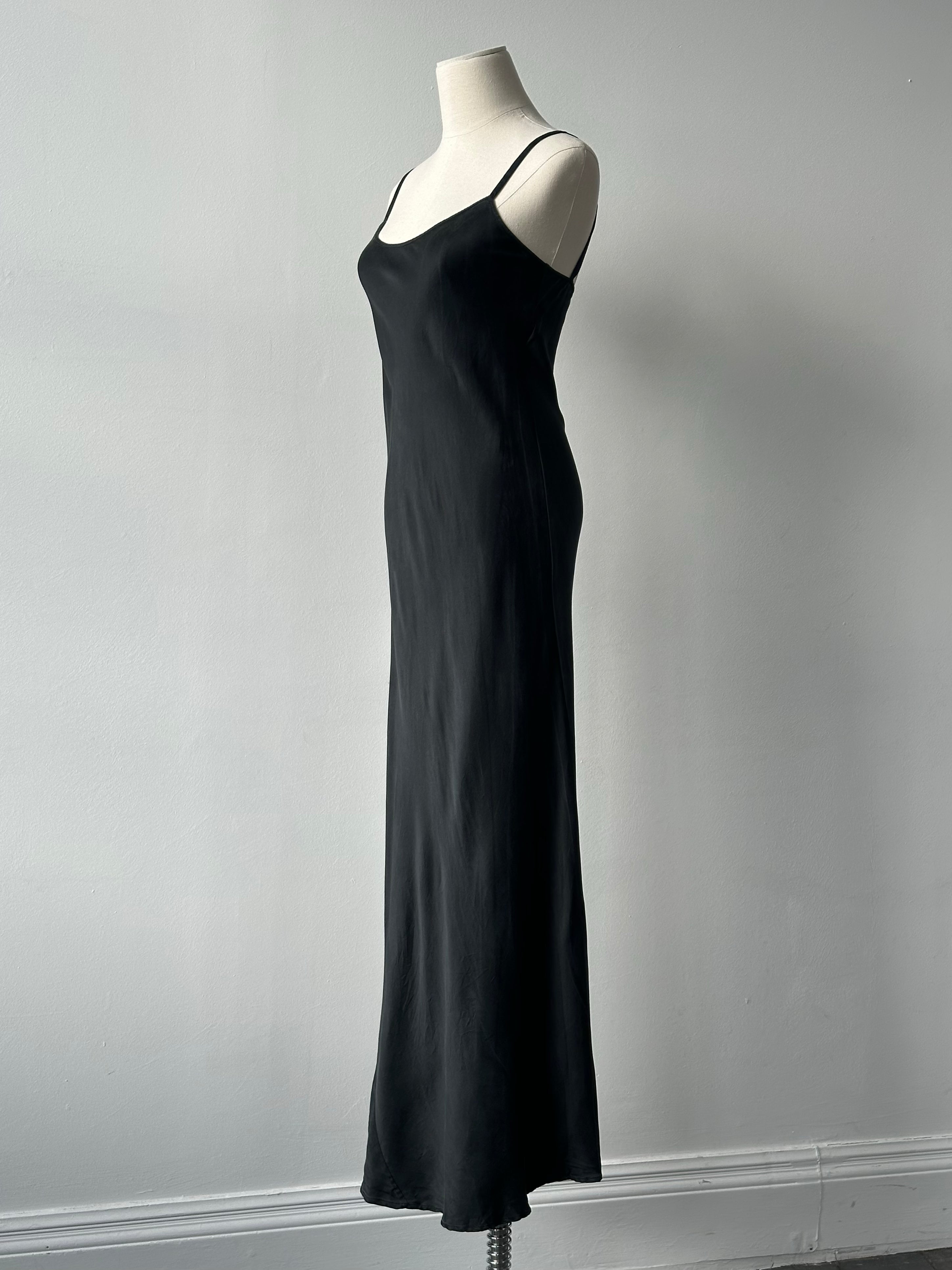 Vintage 1990s pure silk floor length slip dress, size small, shown hanging with elegant drape and subtle sheen.